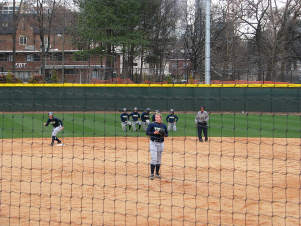 Softball team practices in its new stadium for the first time.