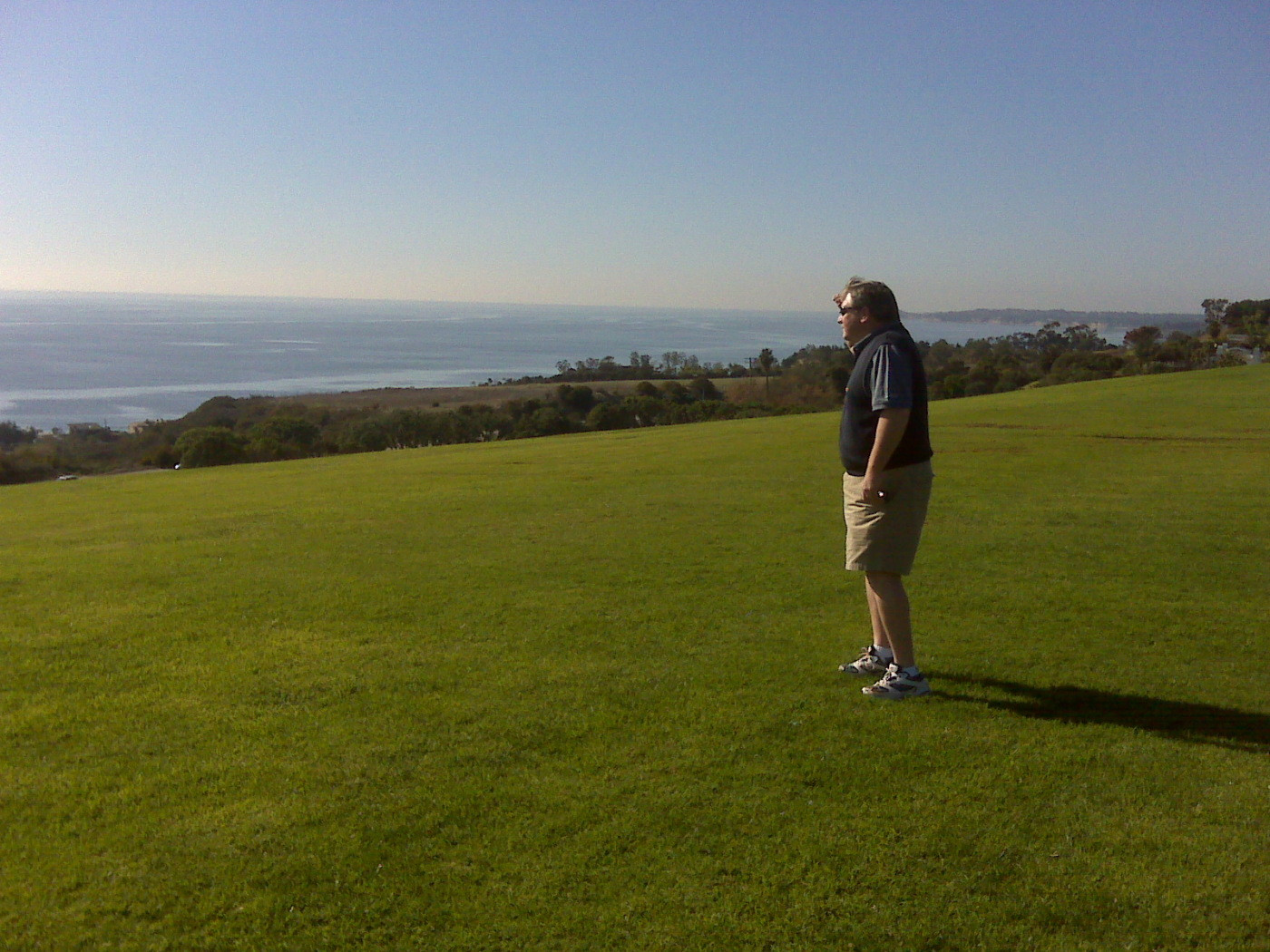 Radio color man Randy Waters looks out over the Pacific Ocean from Alumni Park on the Pepperdine campus - December 19, 2008