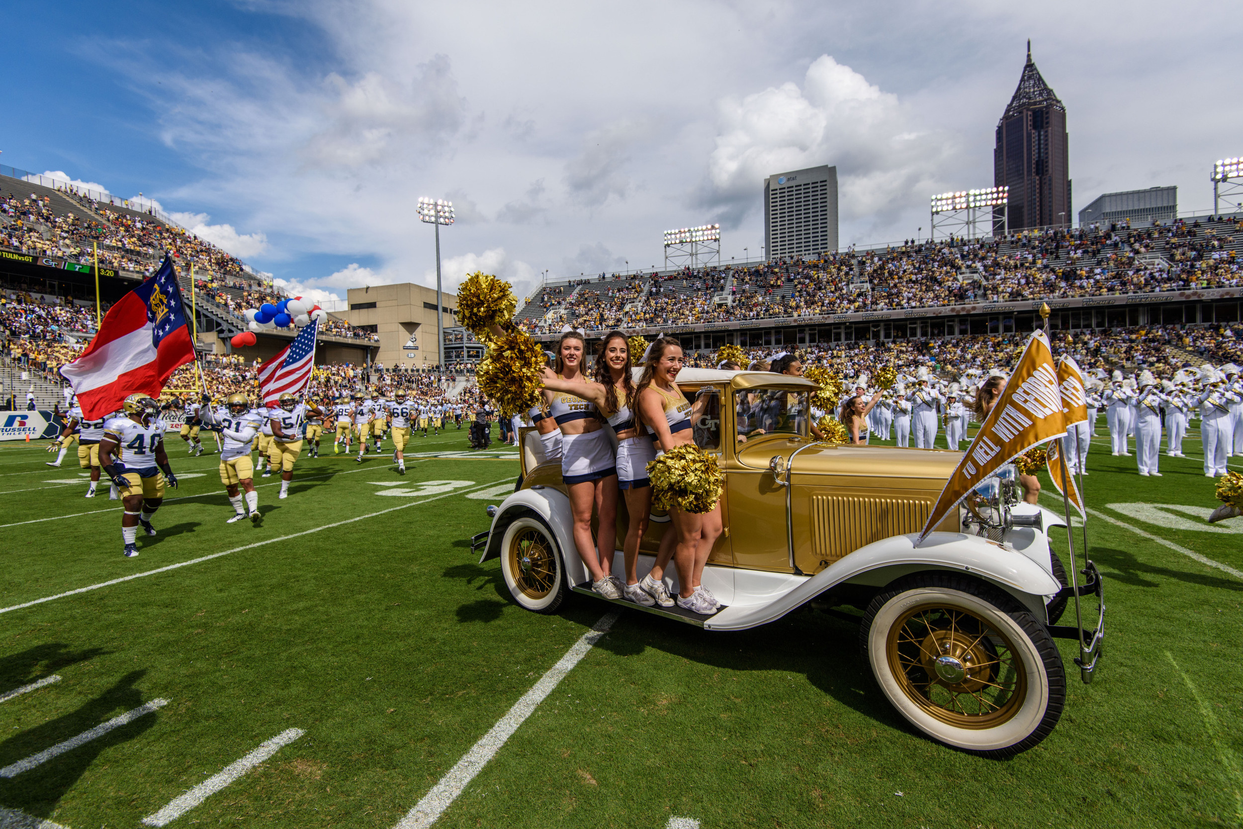 The Ramblin' Reck leads the team onto the field