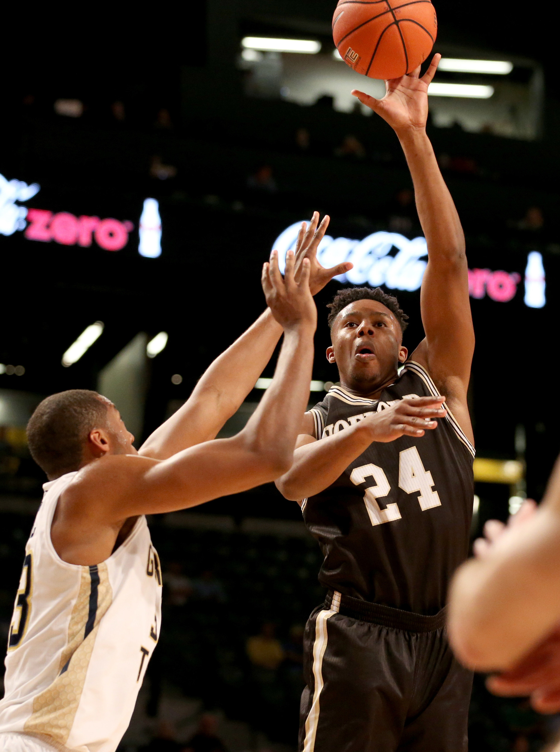 Dec 1, 2015; Atlanta, GA, USA; Wofford Terriers forward Justin Gordon (24) attempts a shot against Georgia Tech Yellow Jackets forward James White (33) in the first half of their game at McCamish Pavilion. Mandatory Credit: Jason Getz-USA TODAY Sports