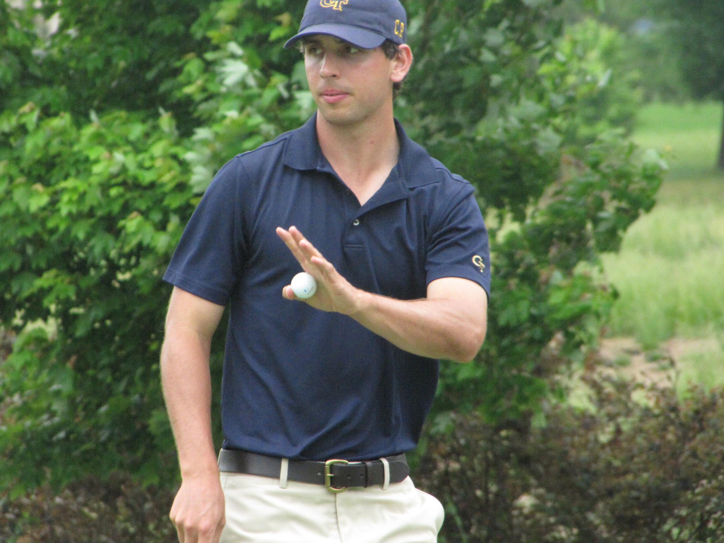 Seth Reeves acknowledges the crowd after dropping a putt at the 7th hole during the first round of the NCAA Raleigh Regional, May 15, 2014