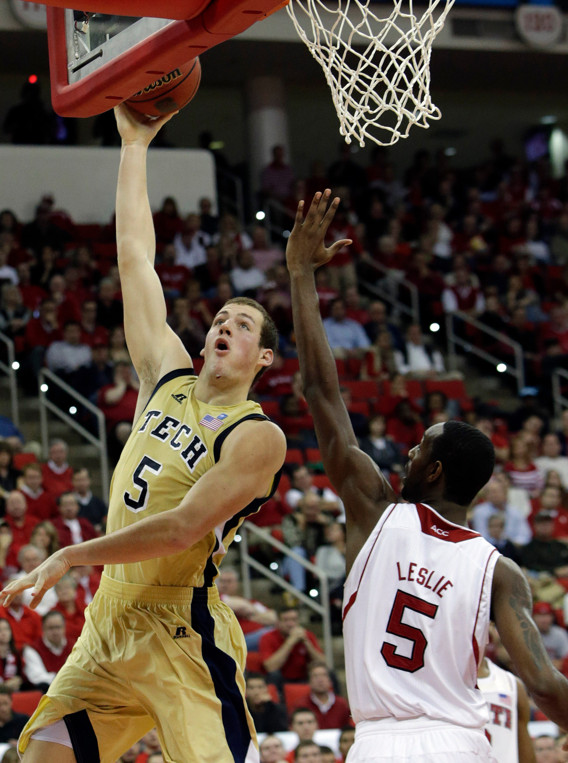 North Carolina State's C.J. Leslie (5) defends against Georgia Tech's Daniel Miller (5) during the second half of an NCAA college basketball game in Raleigh, N.C., Wednesday, Jan. 9, 2013. North Carolina State won 83-70. (AP Photo/Gerry Broome)