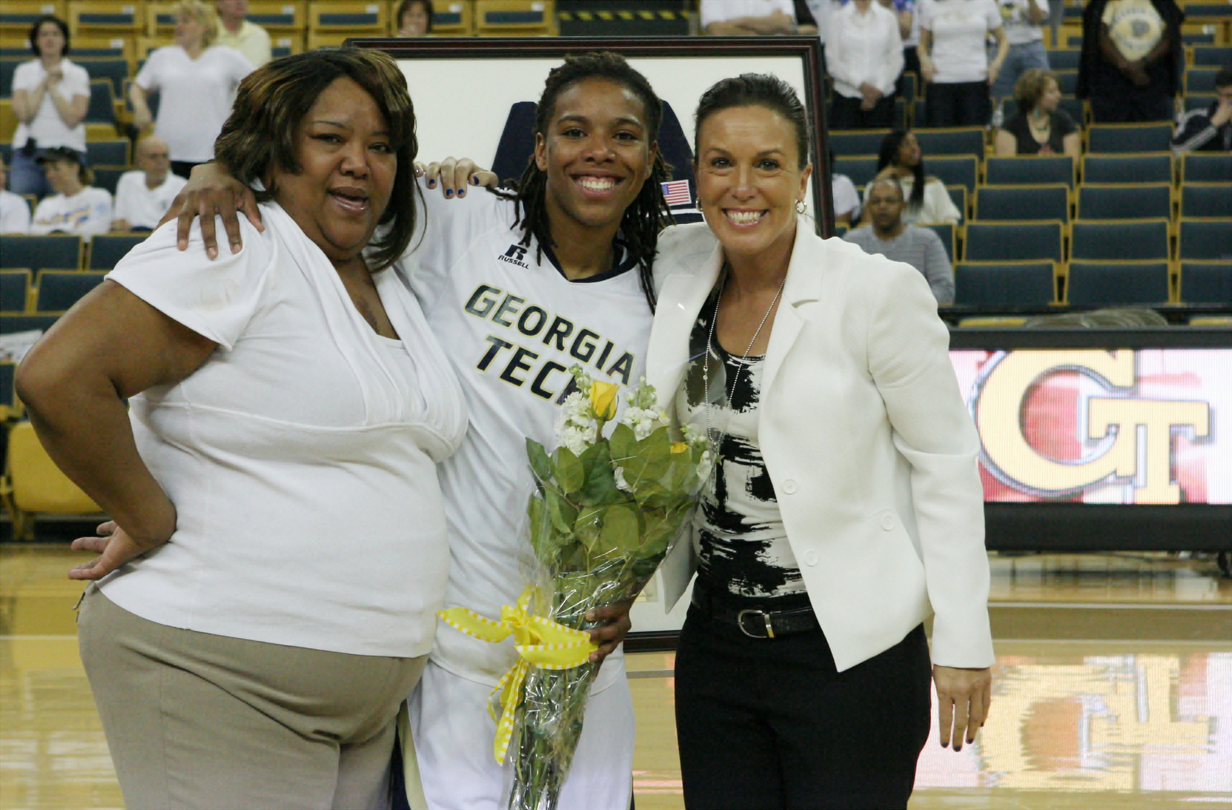 Head Coach MaChelle Joseph with Deja Foster and Foster's mom