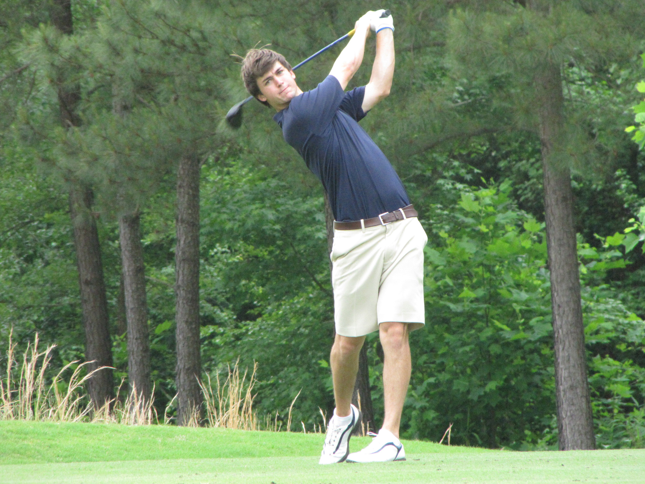 Ollie Schniederjans hits his tee shot at the 9th hole during the first round of the NCAA Raleigh Regional, May 15, 2014