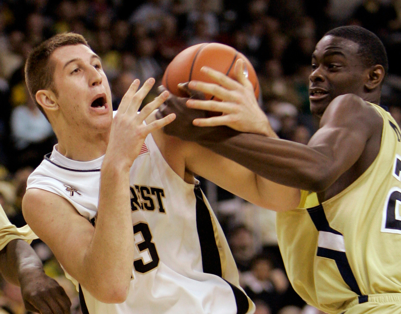 Wake Forest's Chas McFarland and Anthony Morrow wrestle for a rebound during the first half of a basketball game in Winston-Salem, N.C., Wednesday, Feb. 6, 2008.
