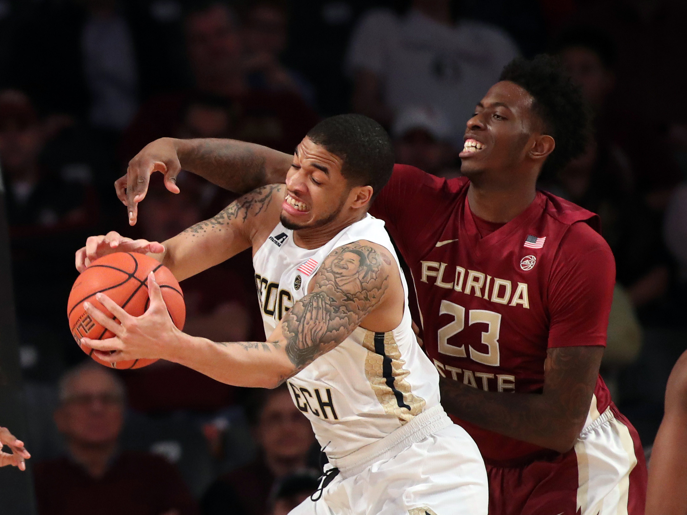 Jan 25, 2017; Tadric Jackson (1) grabs a rebound against Florida State Seminoles forward Jarquez Smith (23) in the first half of their game at McCamish Pavilion. Credit: Jason Getz-USA TODAY Sports