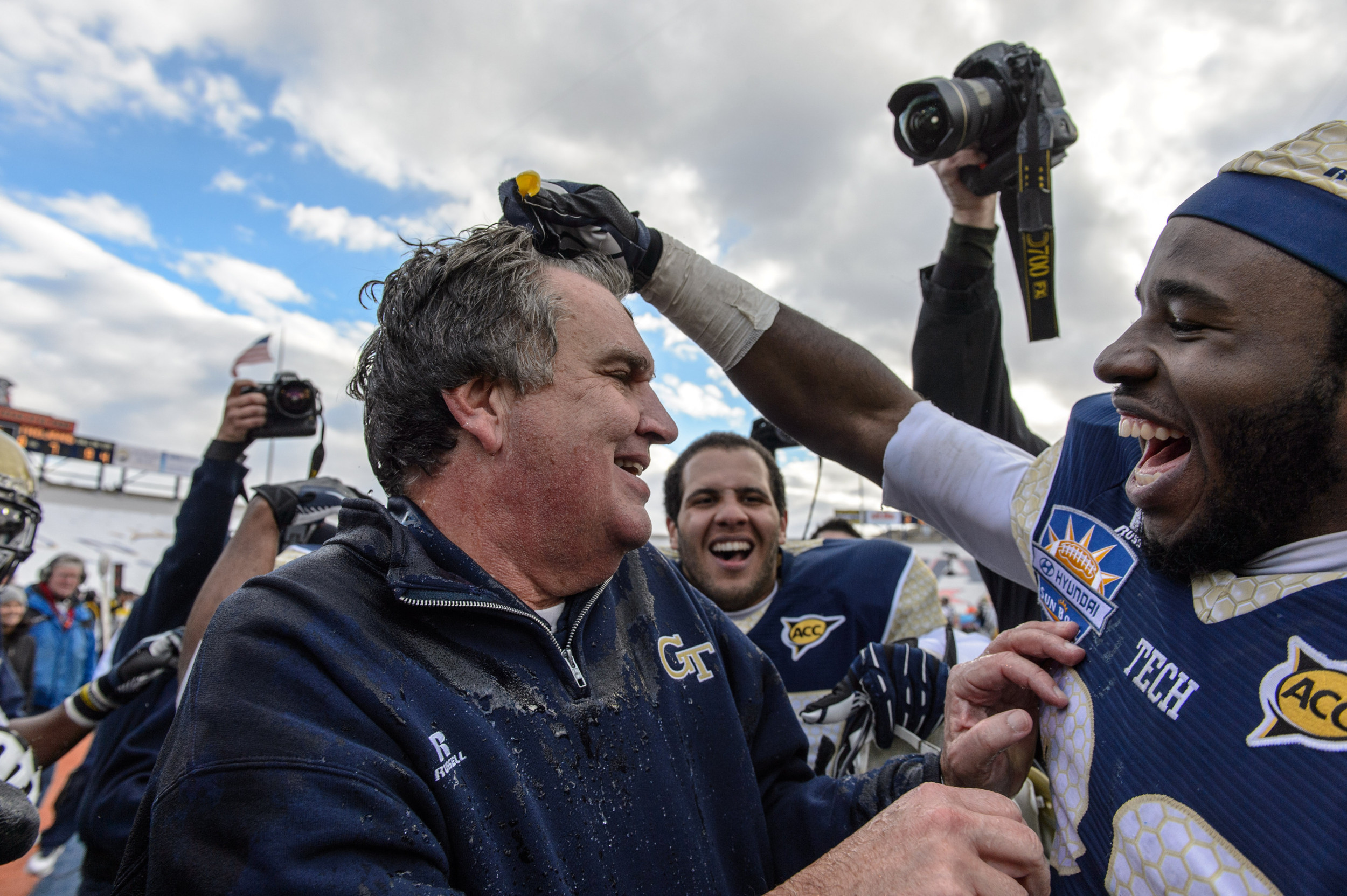 Coach Paul Johnson gets doused with water as the Jackets beat the Trojans.