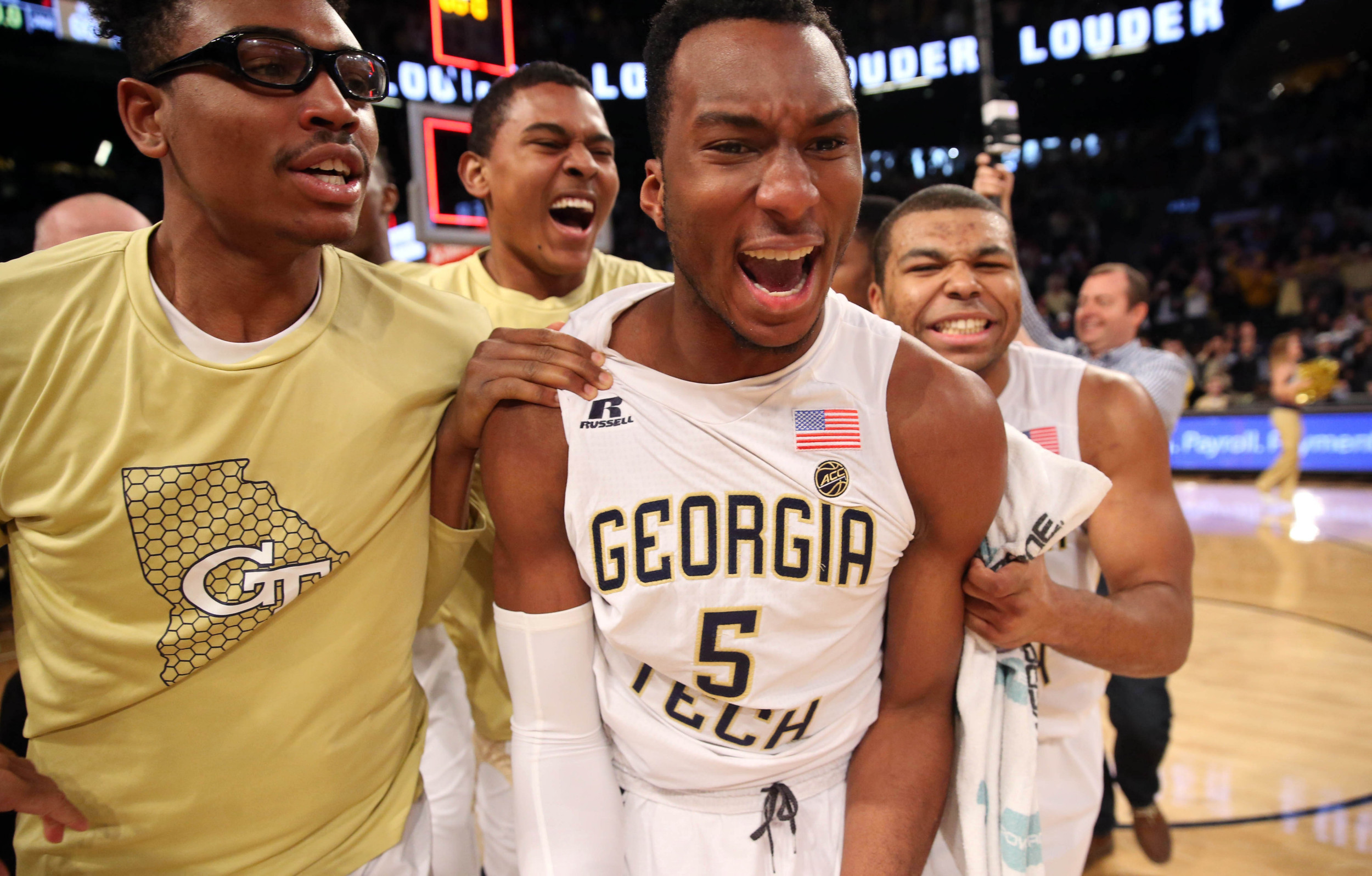 Yellow Jackets guard Josh Okogie (5) celebrates with teammates after he made the game-winning basket. Jason Getz-USA TODAY Sports