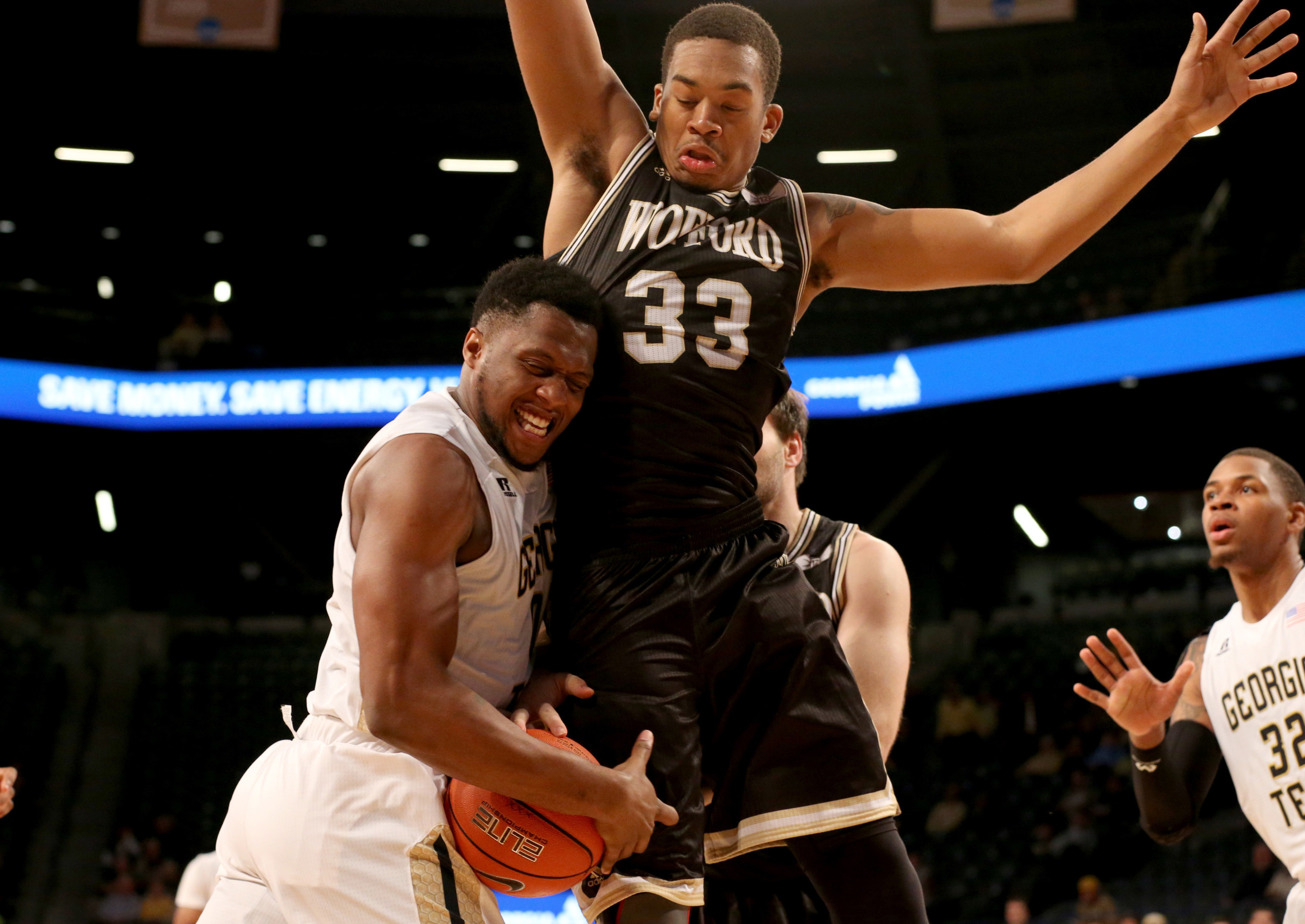 Dec 1, 2015; Atlanta, GA, USA; Georgia Tech Yellow Jackets forward Charles Mitchell (0) is fouled as he drives against Wofford Terriers forward Cameron Jackson (33) in the first half of their game at McCamish Pavilion. Mandatory Credit: Jason Getz-USA TODAY Sports
