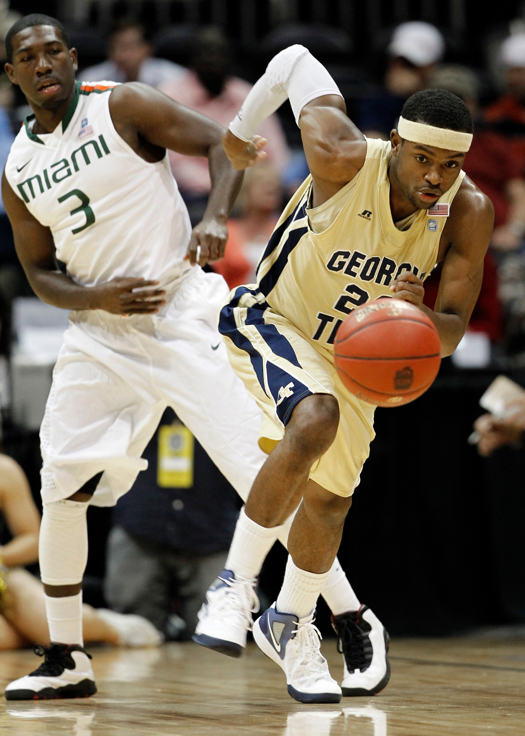 Georgia Tech guard Brandon Reed (23) moves upcourt as Miami guard Malcolm Grant (3) watches during the first half. (AP Photo/John Bazemore)