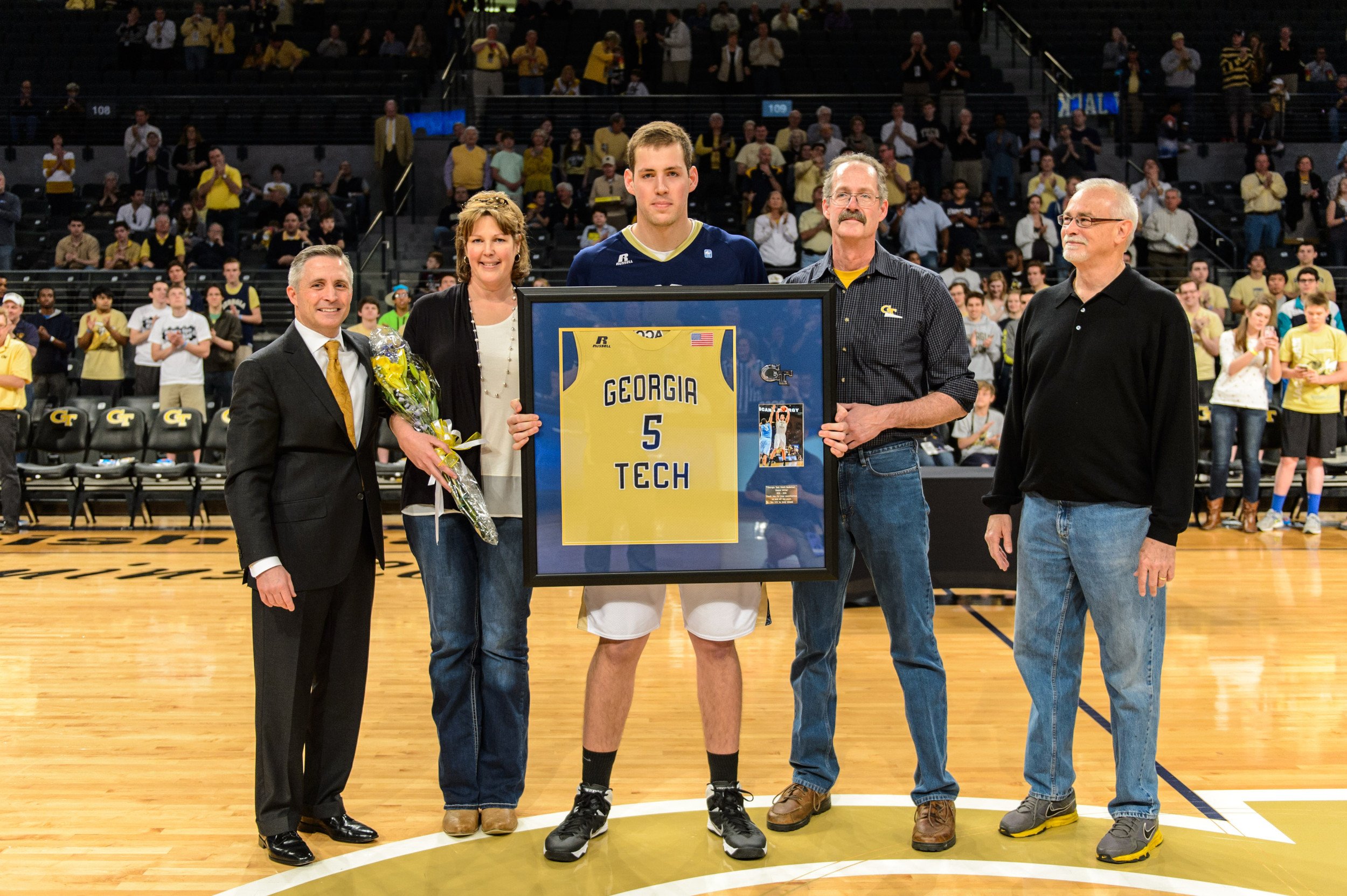Daniel Miller (5) and family with Coach Brian Gregory