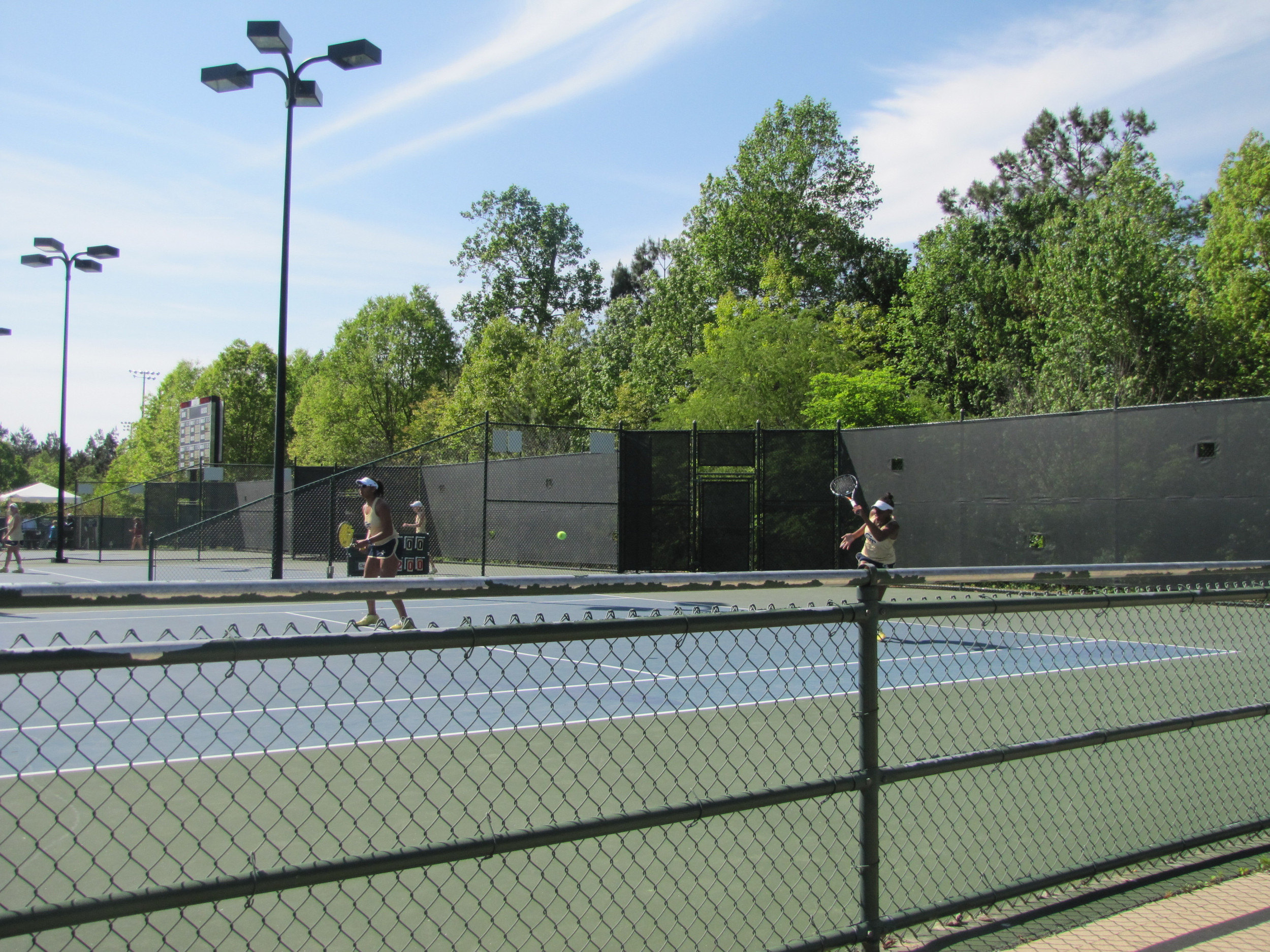 Rasheeda McAdoo and Johnnise Renaud battle in doubles in the ACC Tournament.
