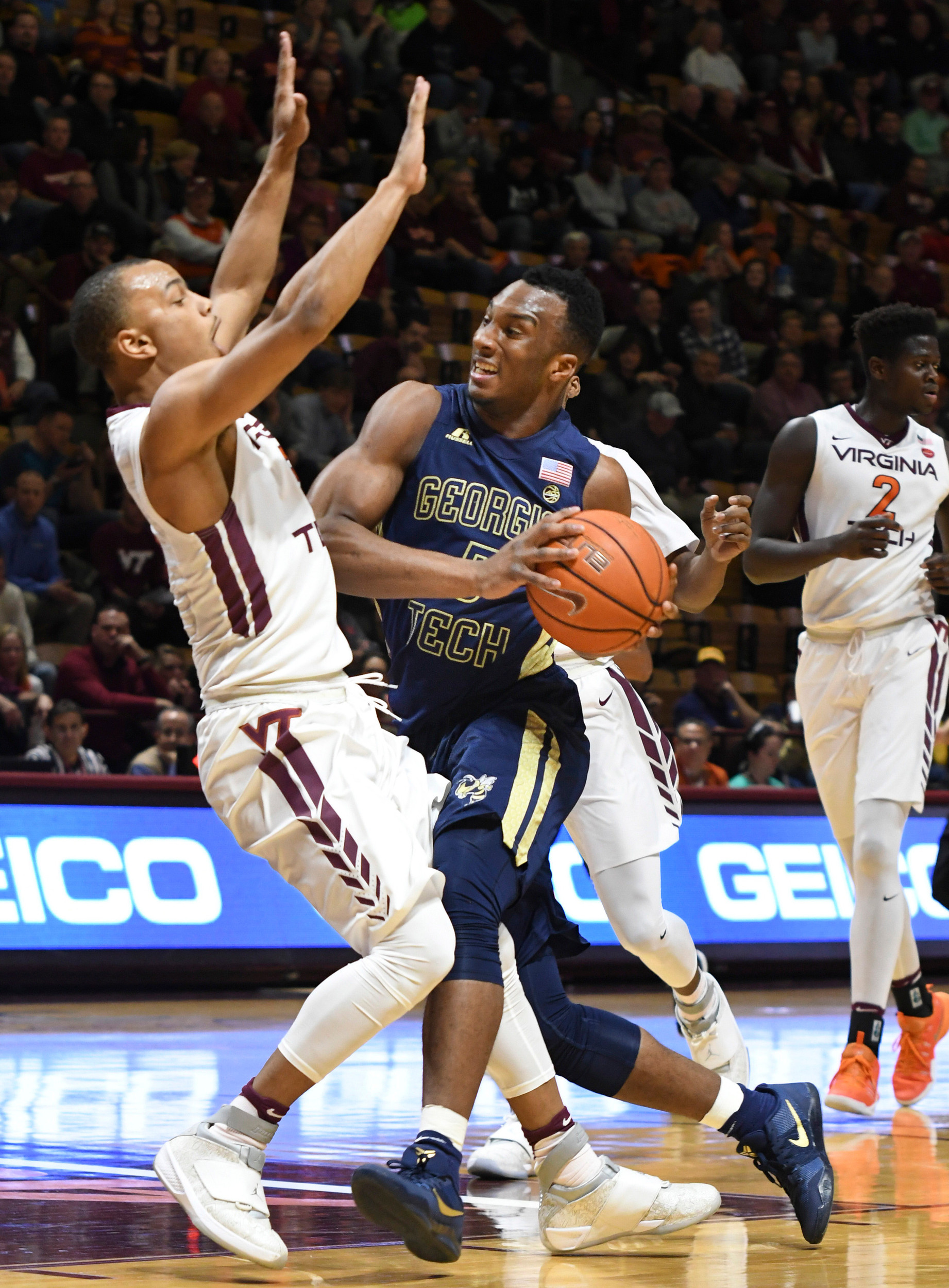 Georgia Tech Yellow Jackets guard Josh Okogie (5) drives to the basket and is fouled by Virginia Tech Hokies guard Justin Robinson (5) in the first half at Cassell Coliseum. Michael Shroyer-USA TODAY Sports