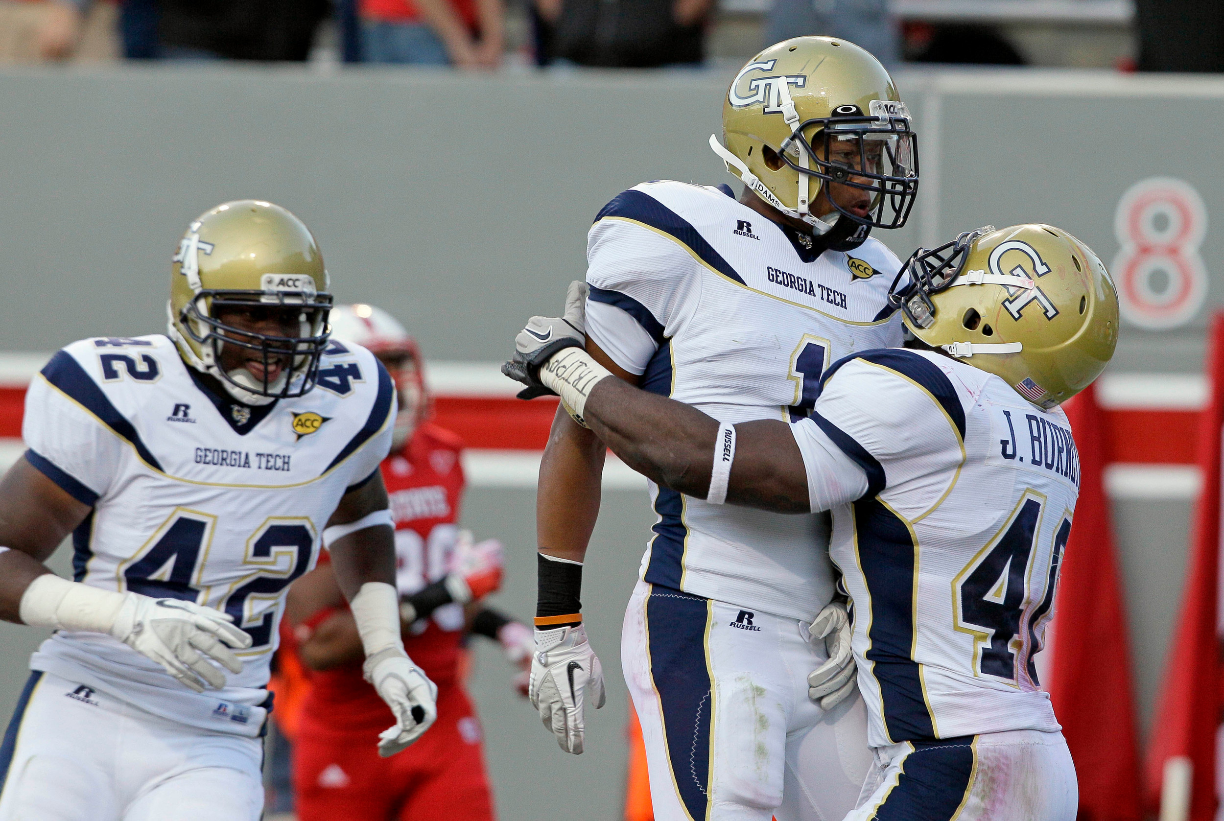 Georgia Tech's Isaiah Johnson (1) celebrates his touchdown following an interception against NC State. (AP Photo/Gerry Broome)