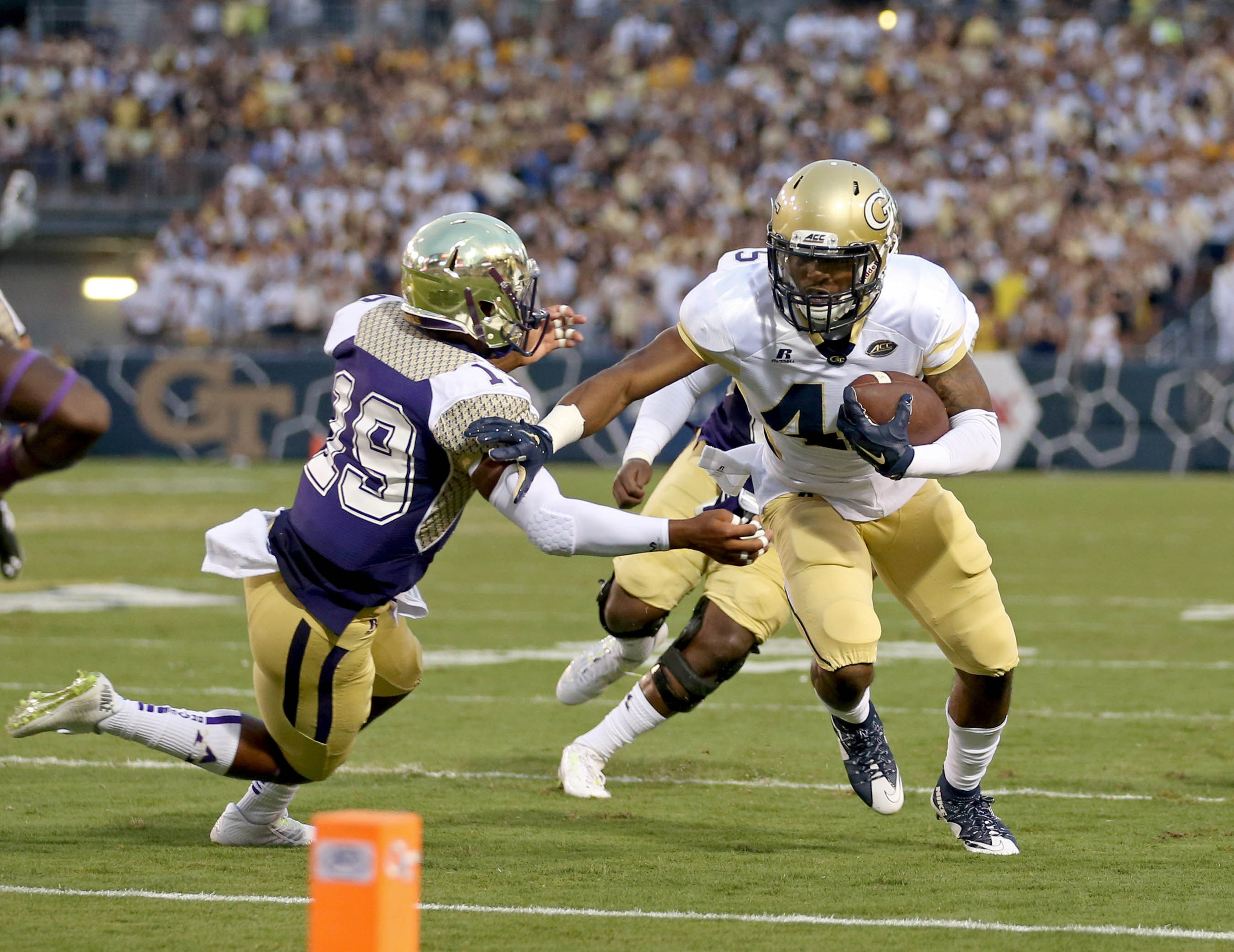 Georgia Tech Yellow Jackets running back Clinton Lynch (49) fights for yards against Alcorn State Braves defensive back Anthony Williams Jr. (19) in the first quarter of their game at Bobby Dodd Stadium. Credit: Jason Getz-USA TODAY Sports