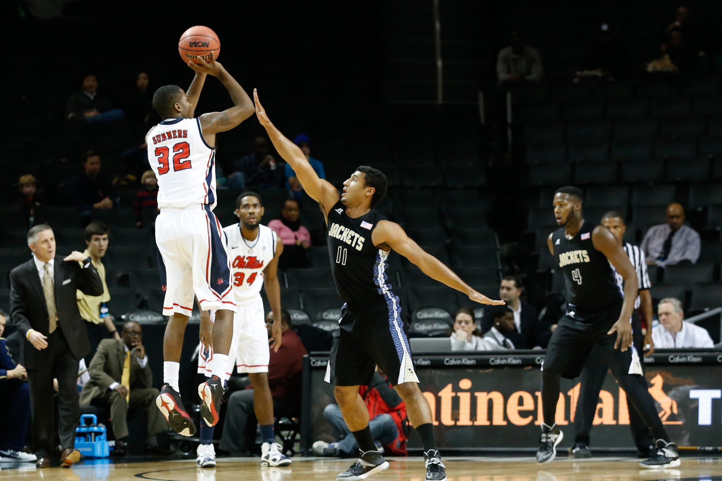 Nov 29, 2013; Brooklyn, NY, USA; Mississippi Rebels guard Jarvis Summers (32) shoots over Georgia Tech Yellow Jackets guard Chris Bolden (11) during the first half at Barclays Center. Mandatory Credit: Anthony Gruppuso-USA TODAY Sports