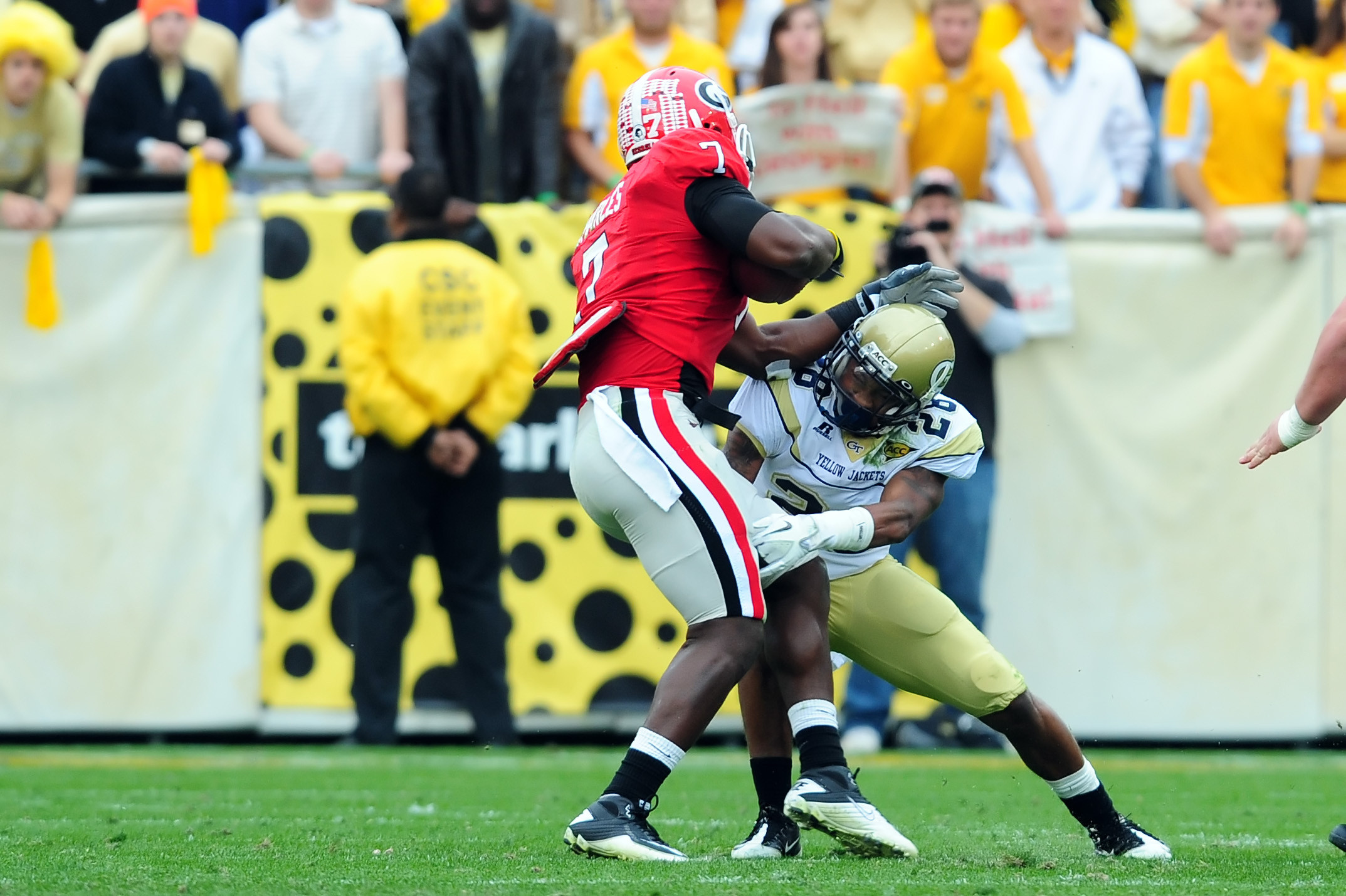 Georgia Tech corner back Rashaad Reid looks to bring down Georgia tight end Orson Charles.Georgia Tech vs GeorgiaAtlanta, GANovember 26, 2011Photos by David Johnson/LensEffects