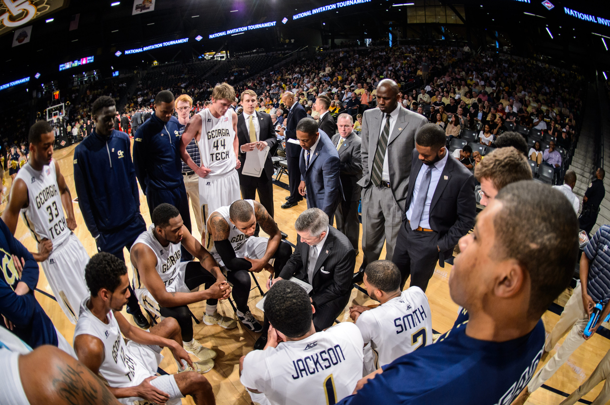 Coach Gregory talks to the team during a timeout