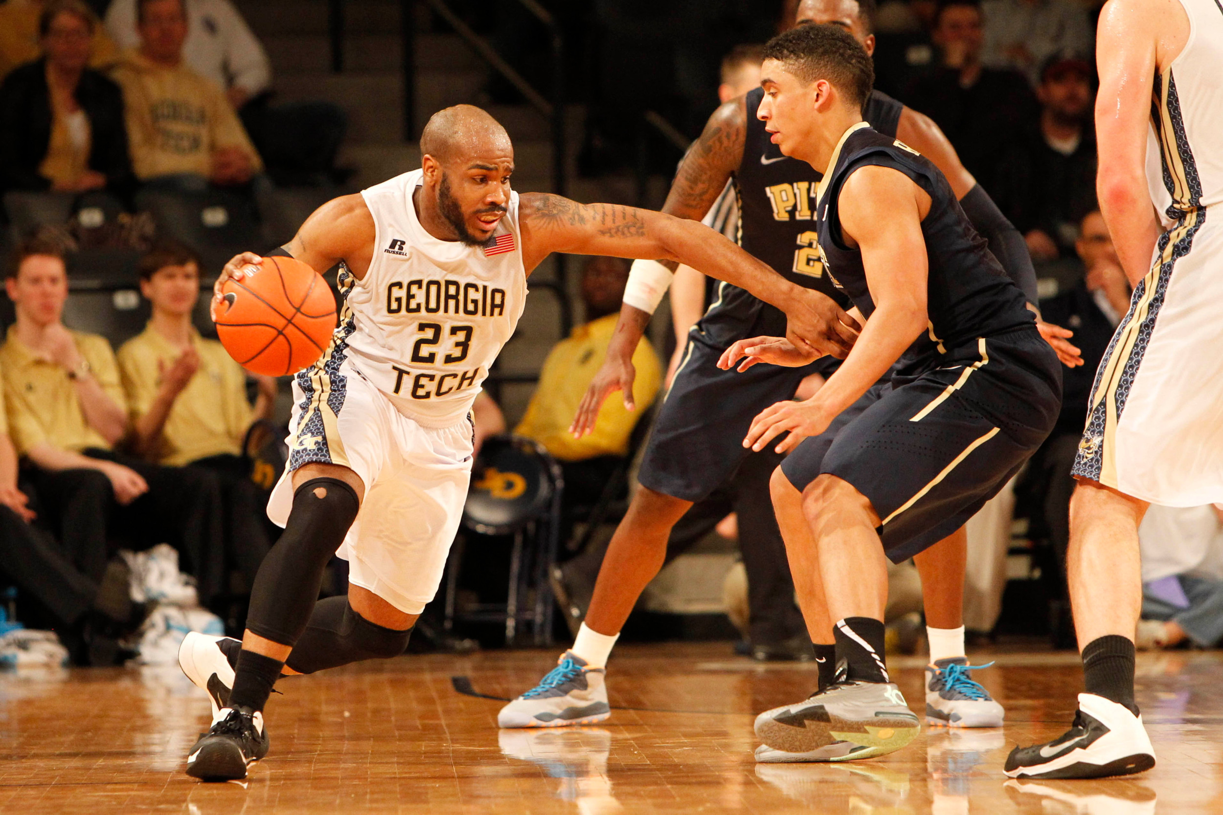 Jan 14, 2014; Atlanta, GA, USA; Georgia Tech Yellow Jackets guard Trae Golden (23) is defended by Pittsburgh Panthers guard James Robinson (0) in the second half at Hank McCamish Pavilion. Pittsburgh defeated Georgia Tech 81-74. Mandatory Credit: Brett Davis-USA TODAY Sports