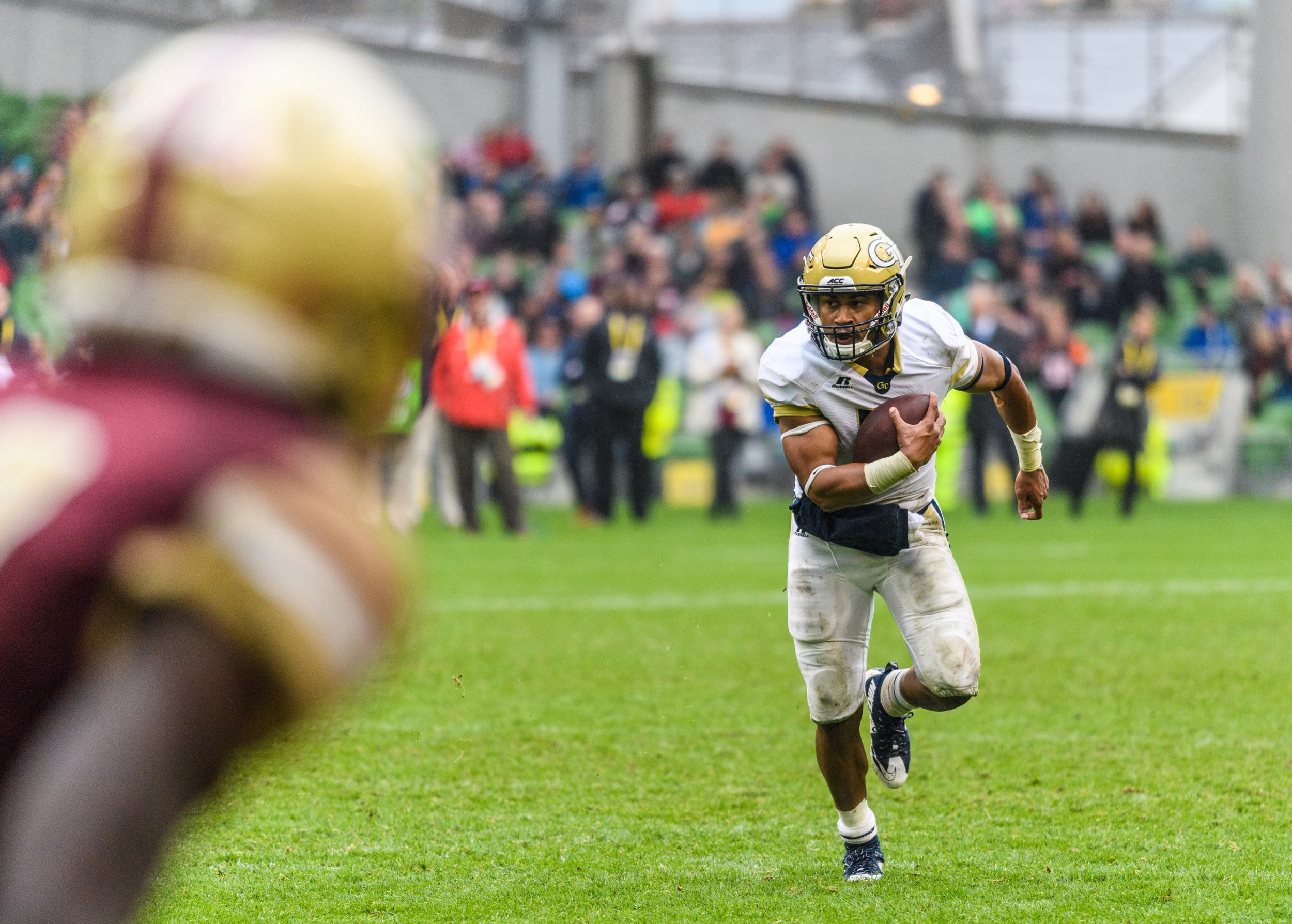 Georgia Tech Quarterback Justin Thomas (5) rushes as a Boston College Defensive Back looms during the second half of an NCAA football game, Saturday, Sept. 3, 2016, in Dublin, Ireland. (Danny Karnik/Georgia Tech via AP)