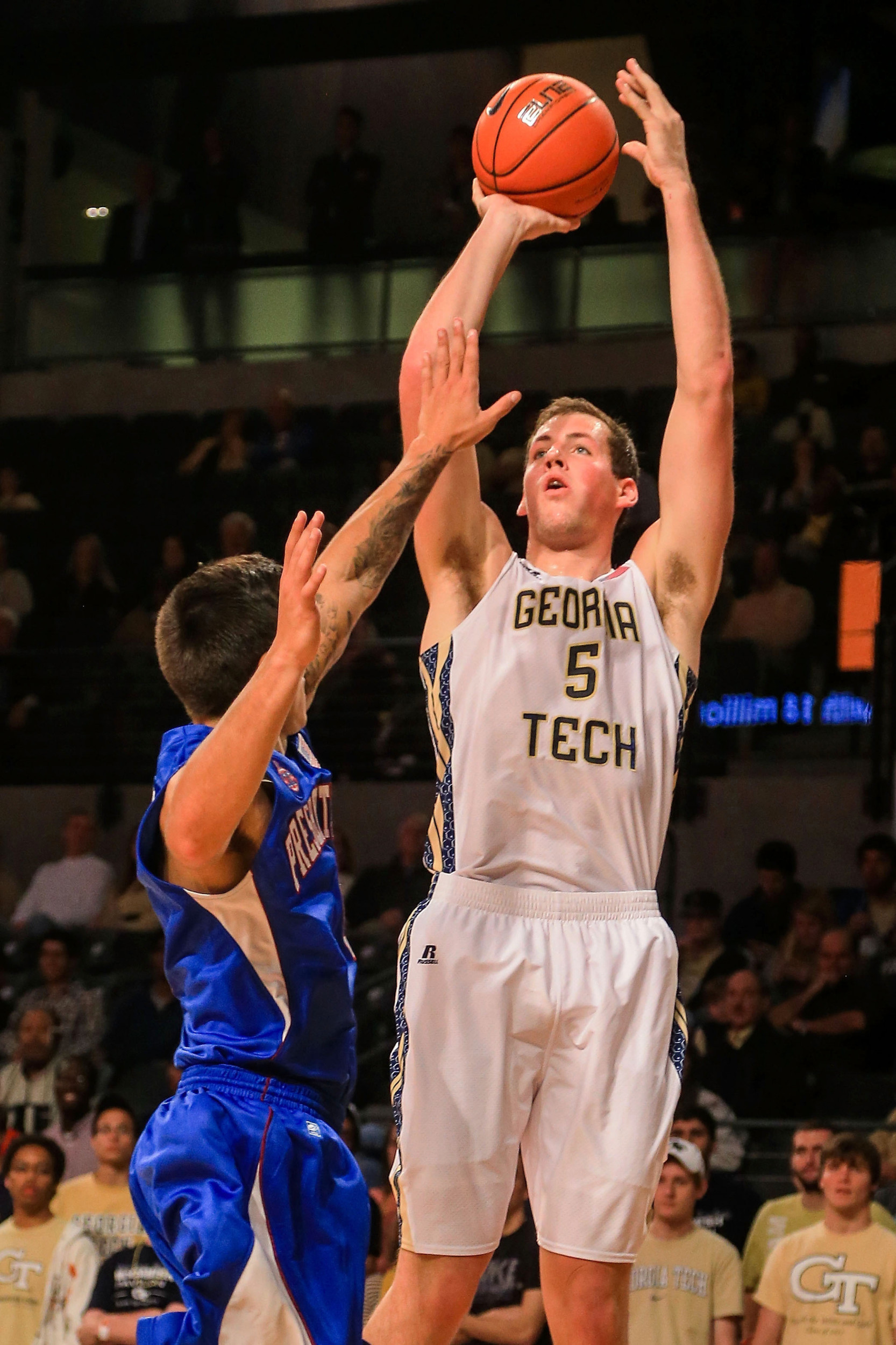 Nov 8, 2013; Atlanta, GA, USA; Georgia Tech Yellow Jackets center Daniel Miller (5) shoots a basket over Presbyterian Blue Hose forward Danny Herrera (0) in the first half at Hank McCamish Pavilion. Mandatory Credit: Daniel Shirey-USA TODAY Sports