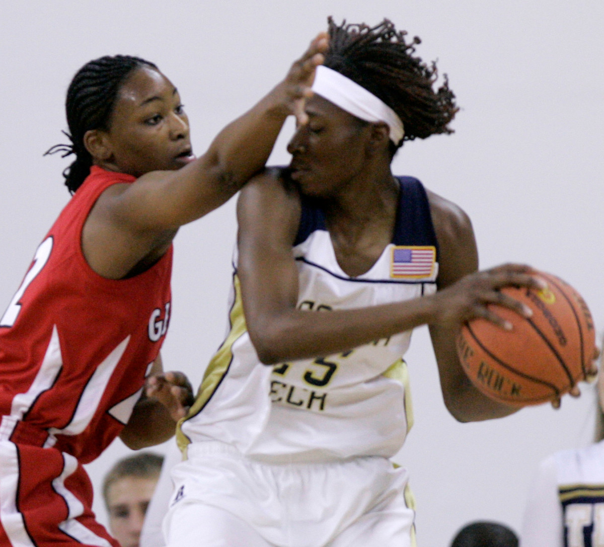 Georgia Tech forward Kentrina Wilson (25) gets pressure from Georgia's Christy Marshall (22) in the first period of women's college basketball action at Georgia Tech in Atlanta, Sunday, Dec. 3, 2006. (AP Photo/Ric Feld)