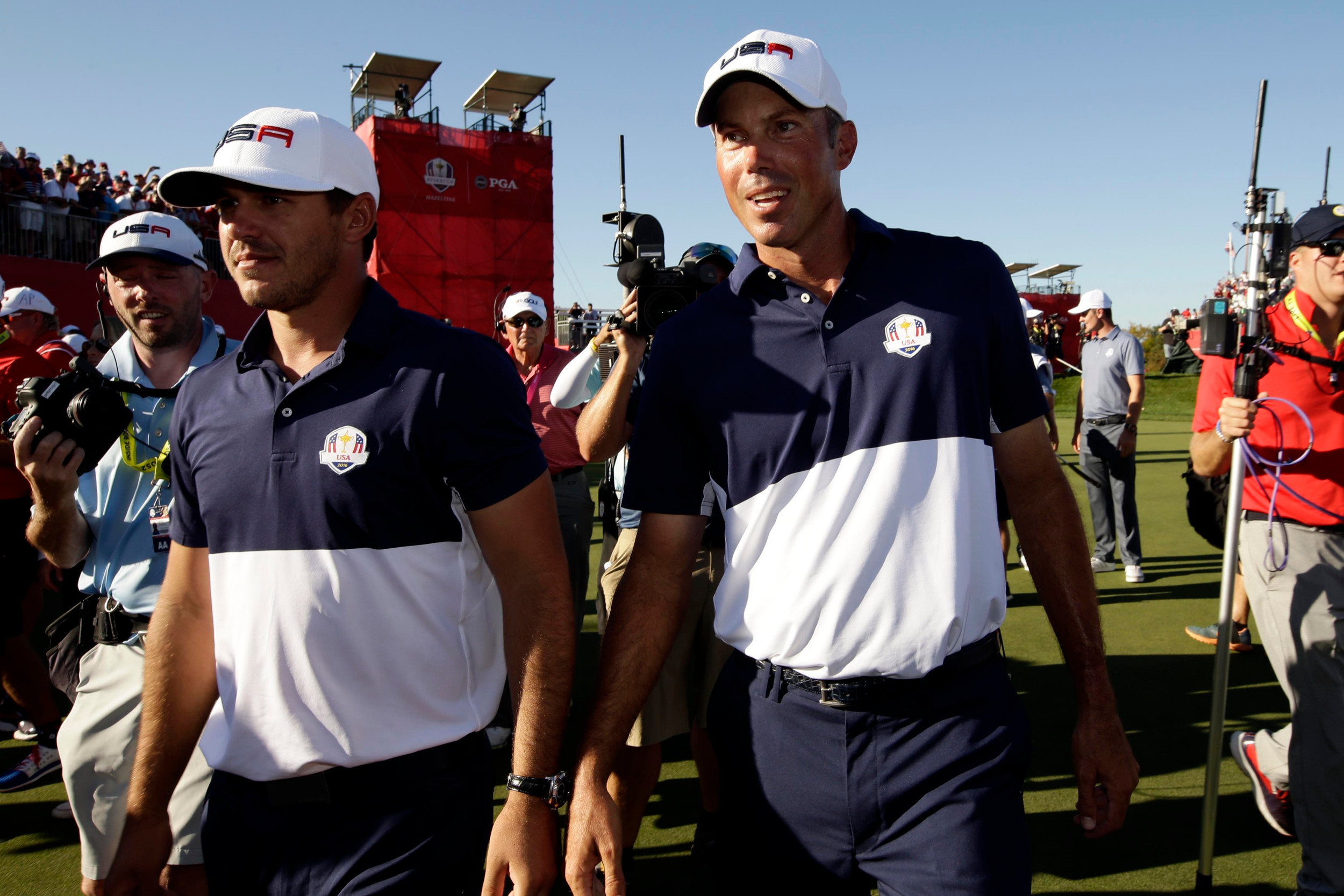Oct 2, 2016; Chaska, MN, USA; Matt Kuchar of the United States and Brooks Koepka of the United States after winning the Ryder Cup during the single matches in 41st Ryder Cup at Hazeltine National Golf Club. Mandatory Credit: Rob Schumacher-USA TODAY Sports
