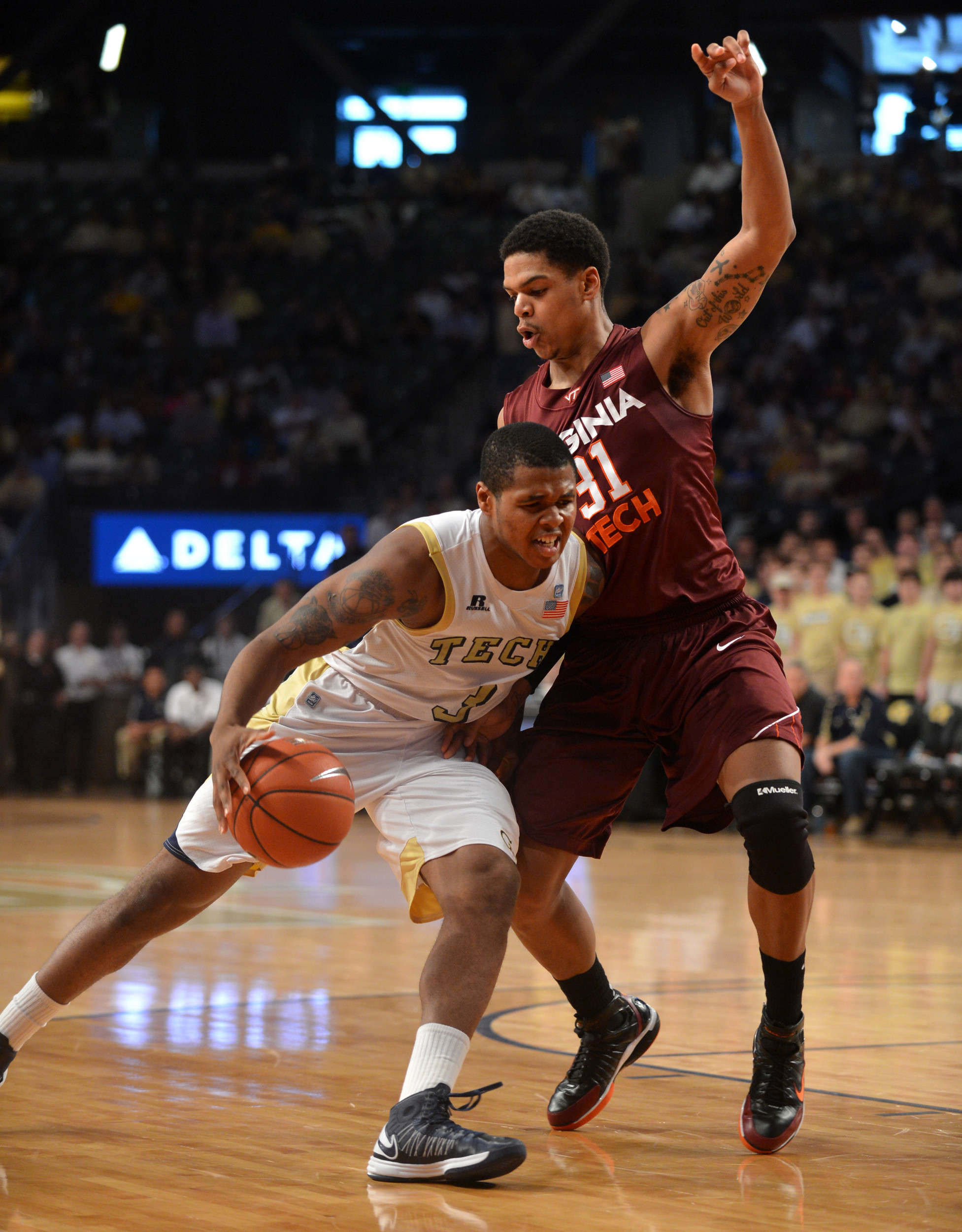 Georgia Tech's Marcus Georges-Hunt, left, works to the basket against Virginia Tech's Jarell Eddie during the second half. (AP Photo/Atlanta Journal-Constitution, Brant Sanderlin)