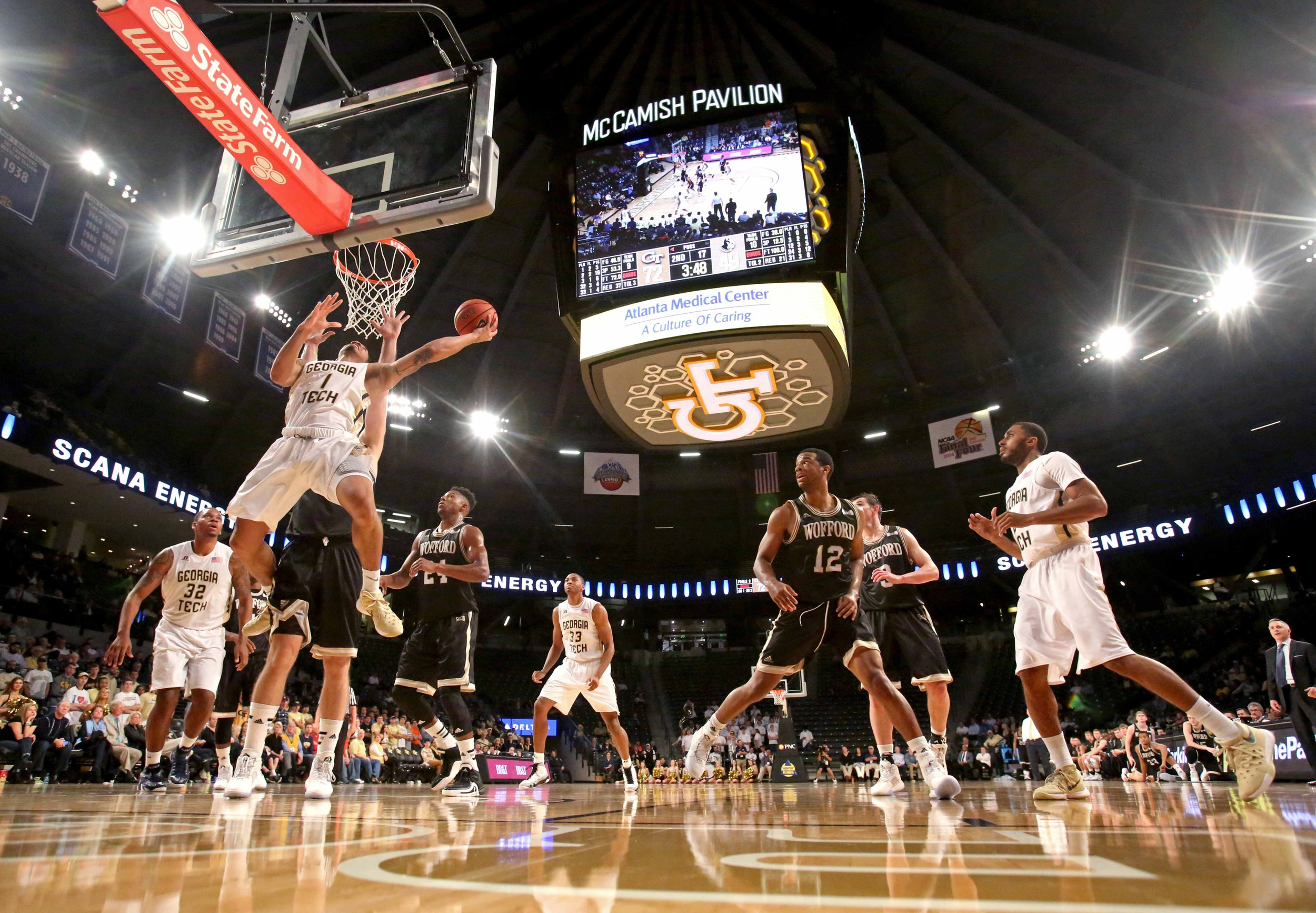 Dec 1, 2015; Atlanta, GA, USA; Georgia Tech Yellow Jackets guard Tadric Jackson (1) scores against Wofford Terriers forward C.J. Neumann (31) in the second half of their game at McCamish Pavilion. The Yellow Jackets won 77-61. Mandatory Credit: Jason Getz-USA TODAY Sports