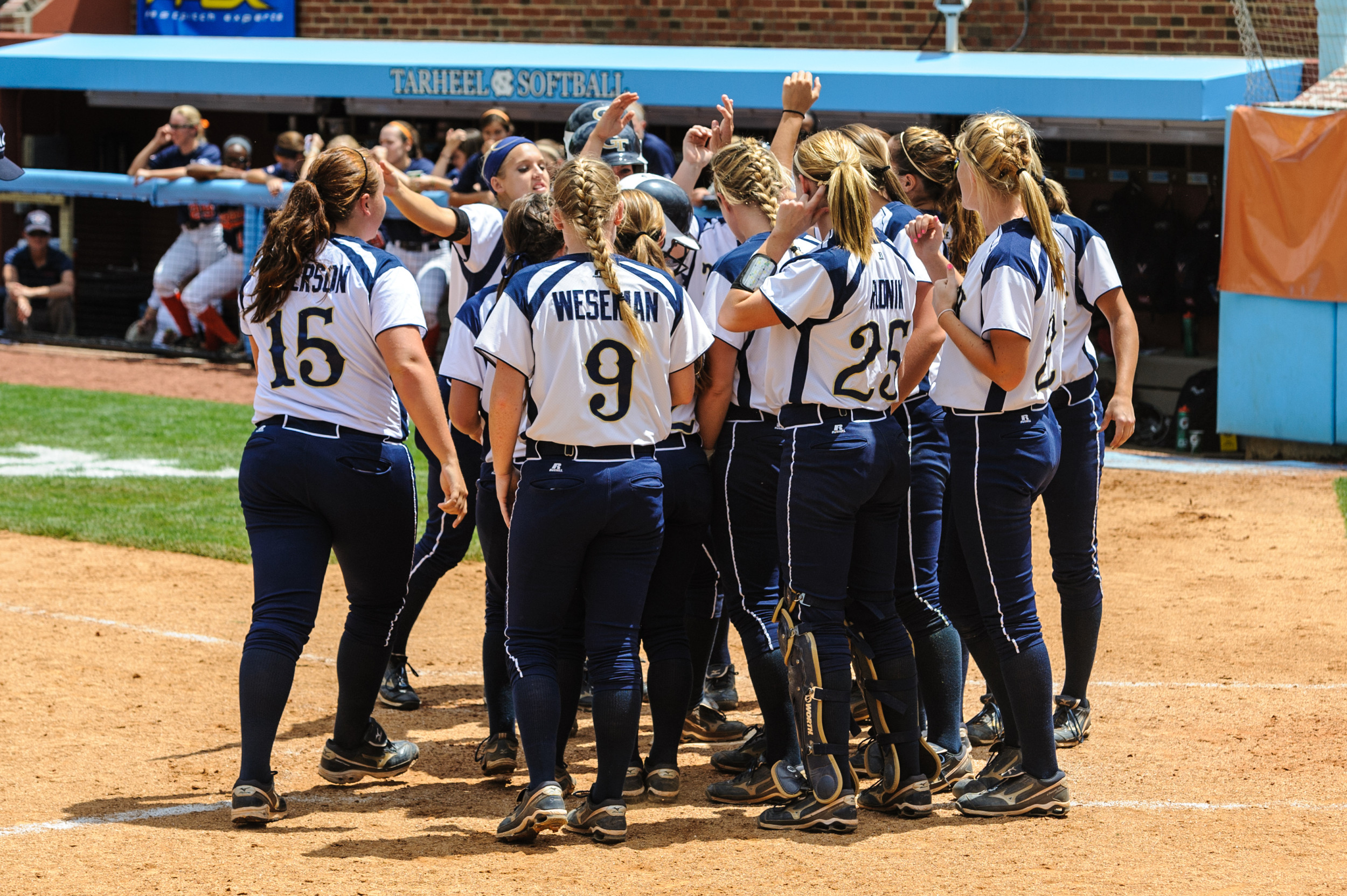 The team celebrates Hope Rush's home run.