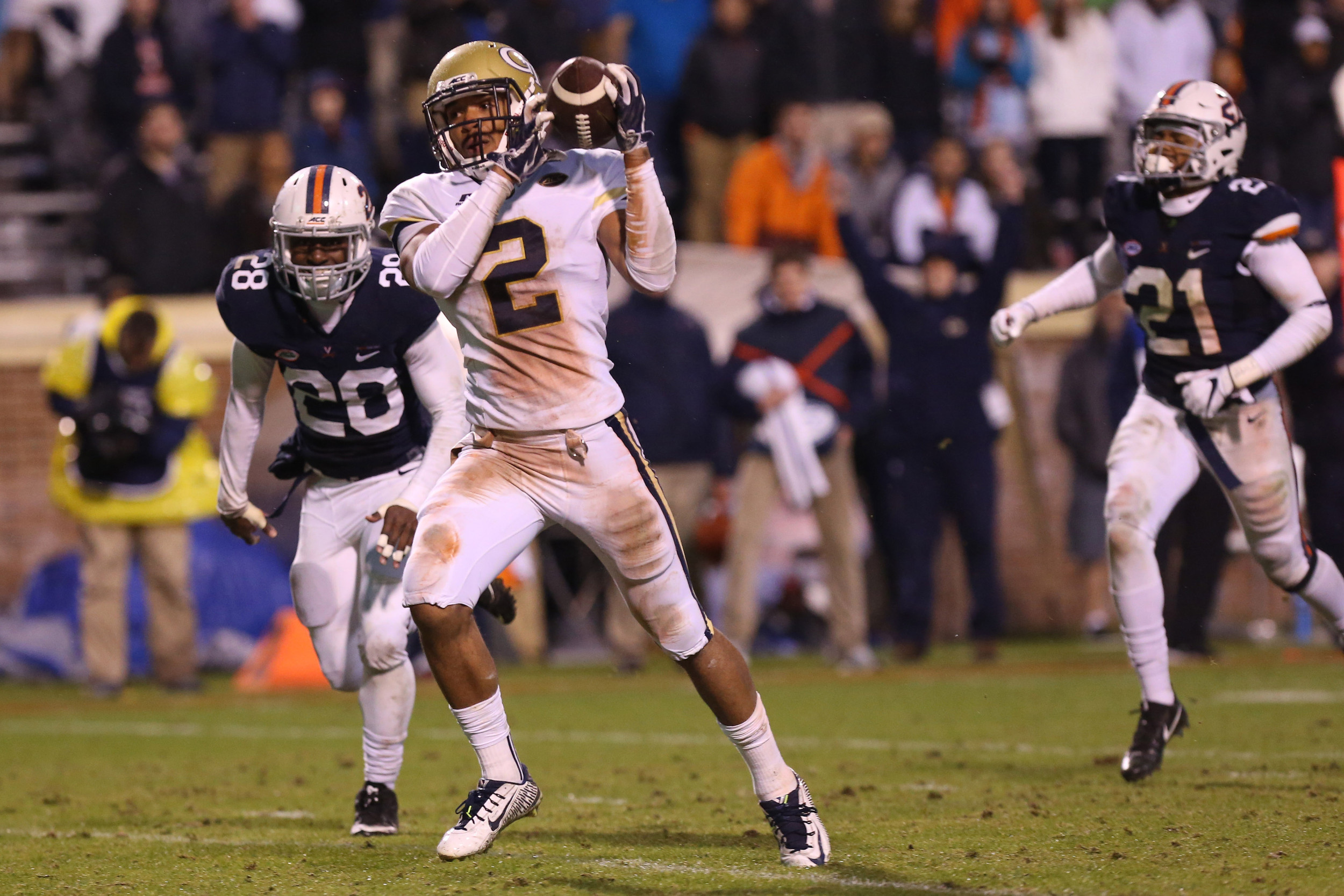 Nov 4, 2017; Charlottesville, VA, USA; Georgia Tech Yellow Jackets wide receiver Ricky Jeune (2) catches a touchdown pass as Virginia Cavaliers safety Nick Grant (20) chases late in the fourth quarter at Scott Stadium. The Cavaliers won 40-36. Mandatory Credit: Geoff Burke-USA TODAY Sports