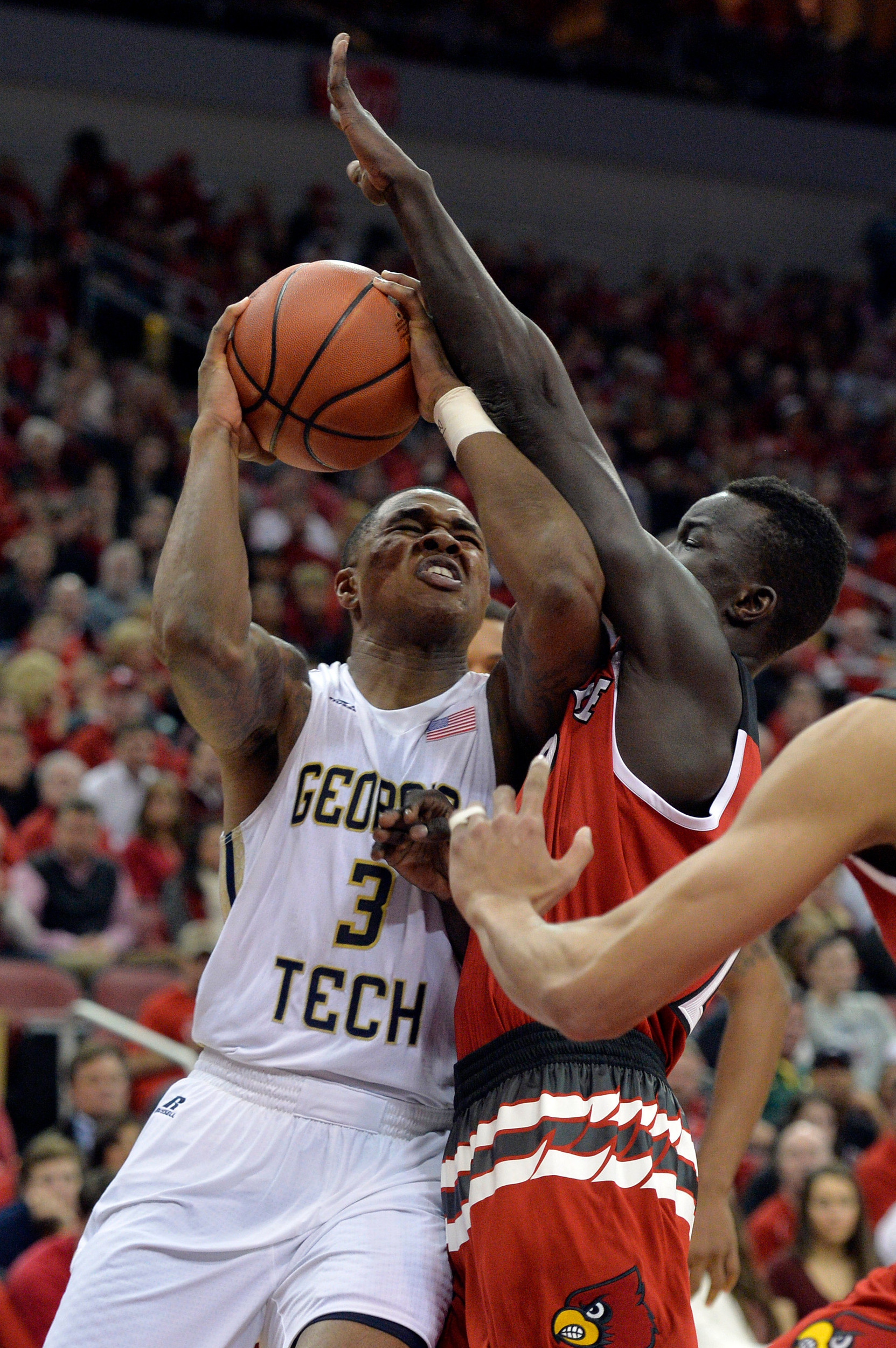 Marcus Georges-Hunt drives to the basket against Louisville Cardinals forward Deng Adel (22) during the first half at KFC Yum! Center. Jamie Rhodes-USA TODAY Sports