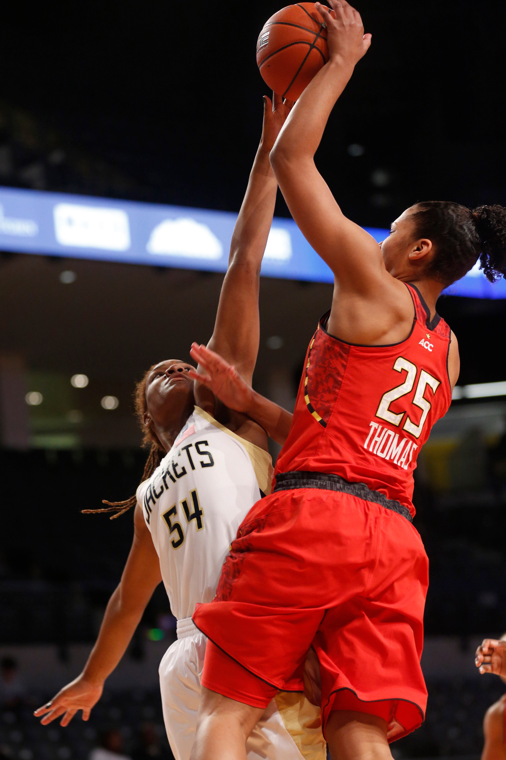 Georgia Tech forward Roddreka Rogers (54) blocks a shot by Maryland forward Alyssa Thomas (25) during the first half. (AP Photo/Josh D. Weiss)