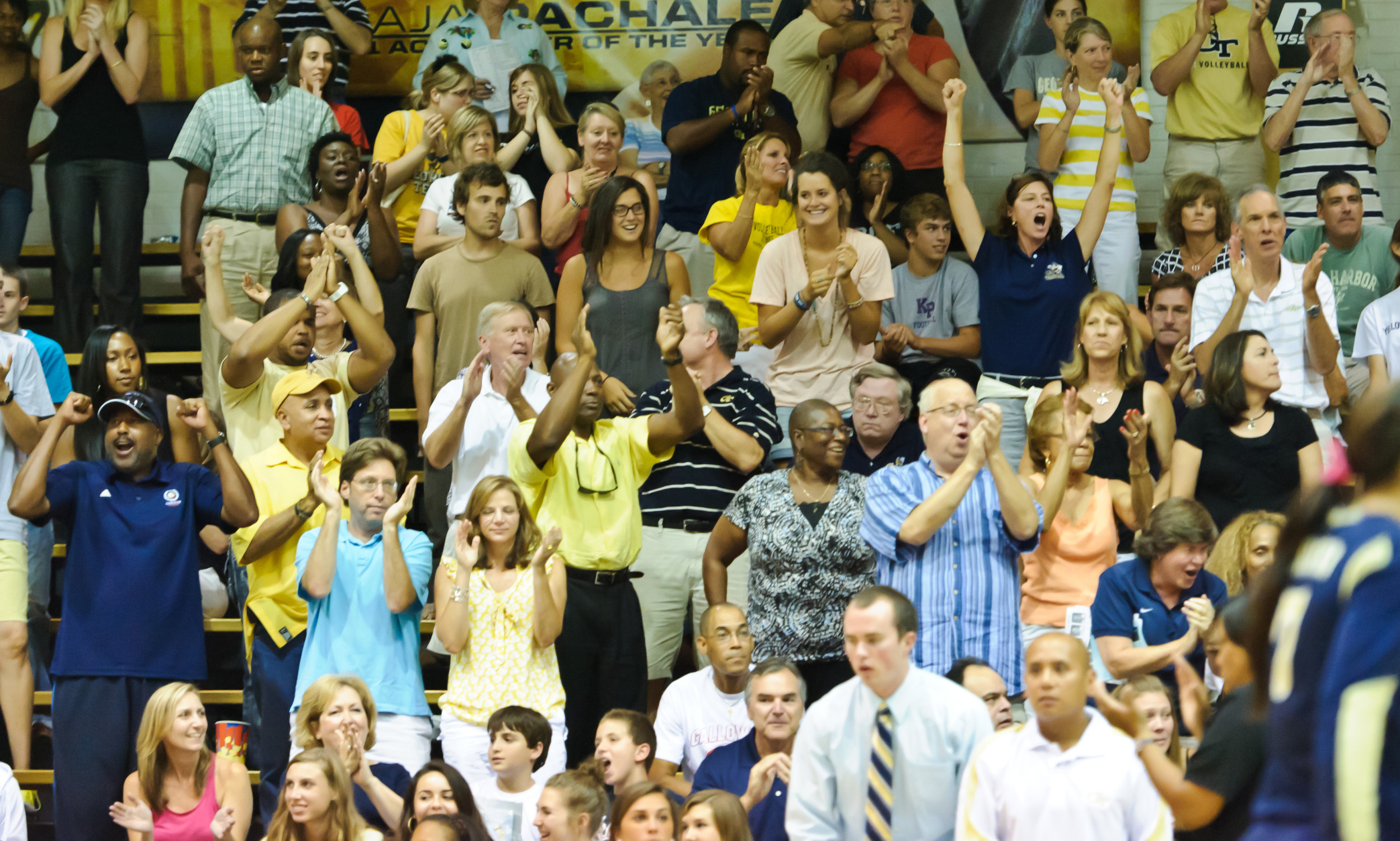 Tech Volleyball fans celebrate.