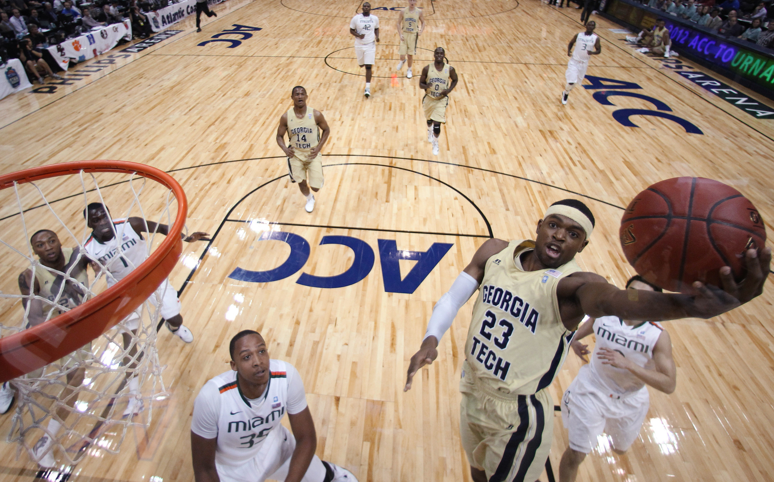 Georgia Tech guard Brandon Reed (23) heads to the basket as Miami's Kenny Kadji (35) looks on during the first half. (AP Photo/Chuck Burton)