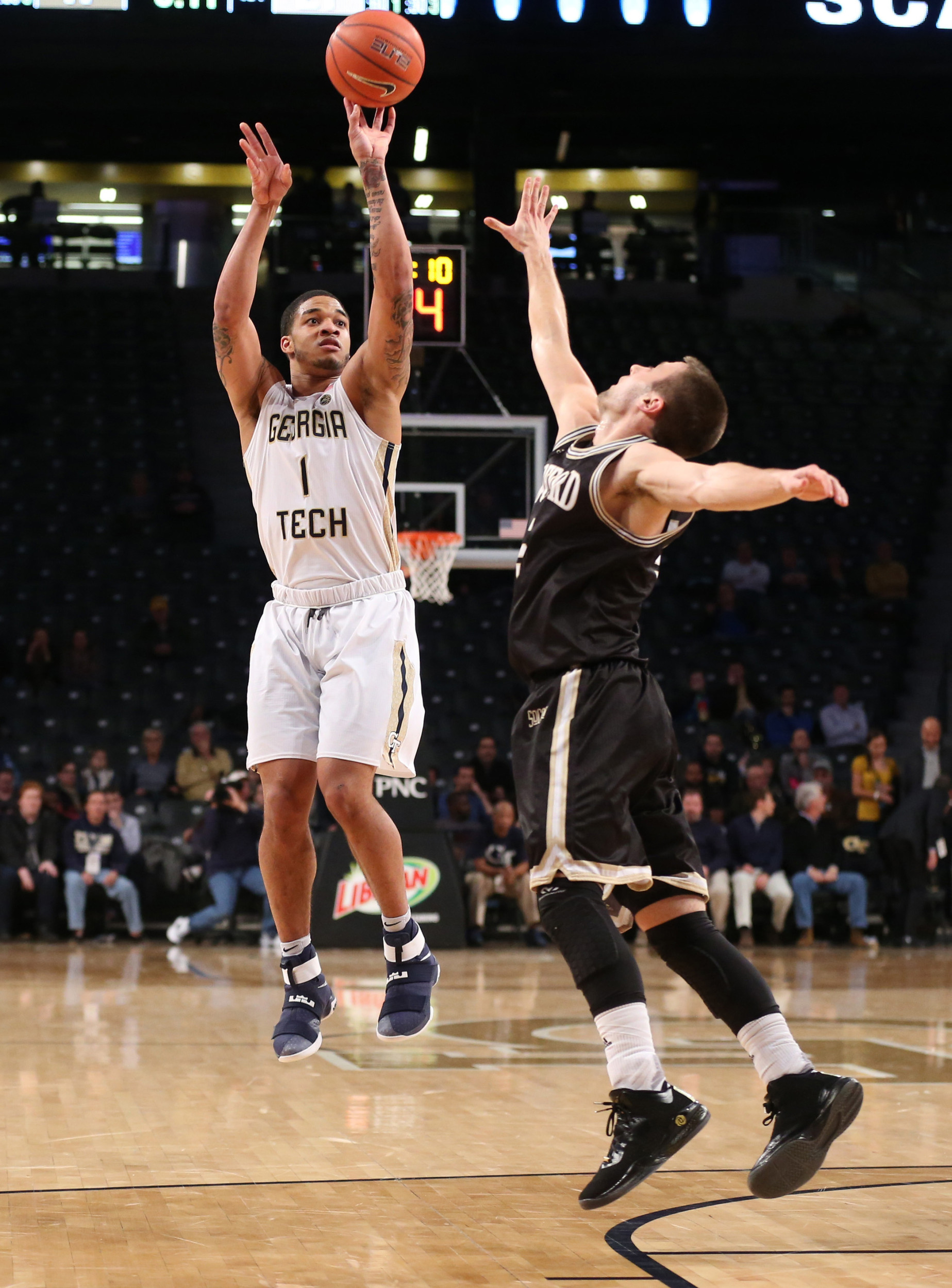 Yellow Jackets guard Tadric Jackson (1) attempts a three-point basket against Wofford Terriers guard Eric Garcia (5) in the first half at McCamish Pavilion. Credit: Jason Getz-USA TODAY Sports