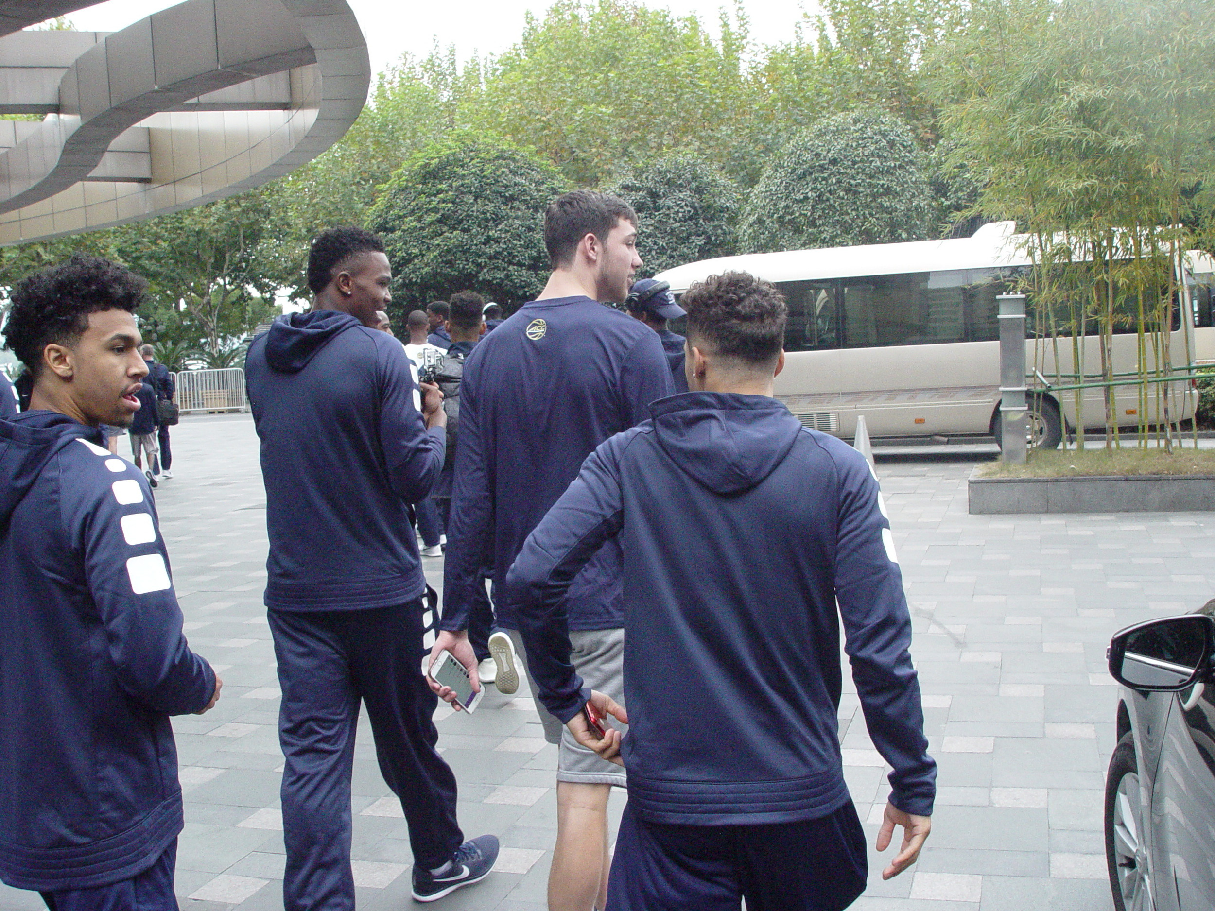Georgia Tech men's basketball team, on their first full day in Hangzhou, China, leave the hotel for a morning walk, November 5, 2017