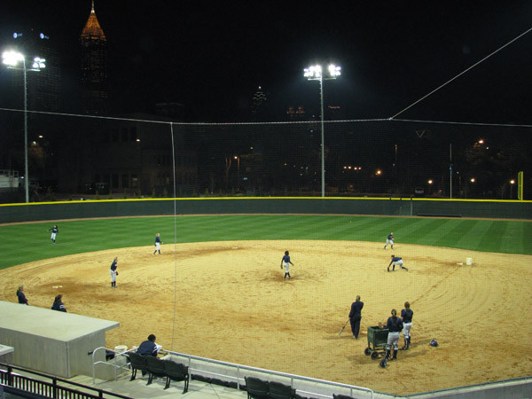 Softball team practices at night for the first time in its new stadium.