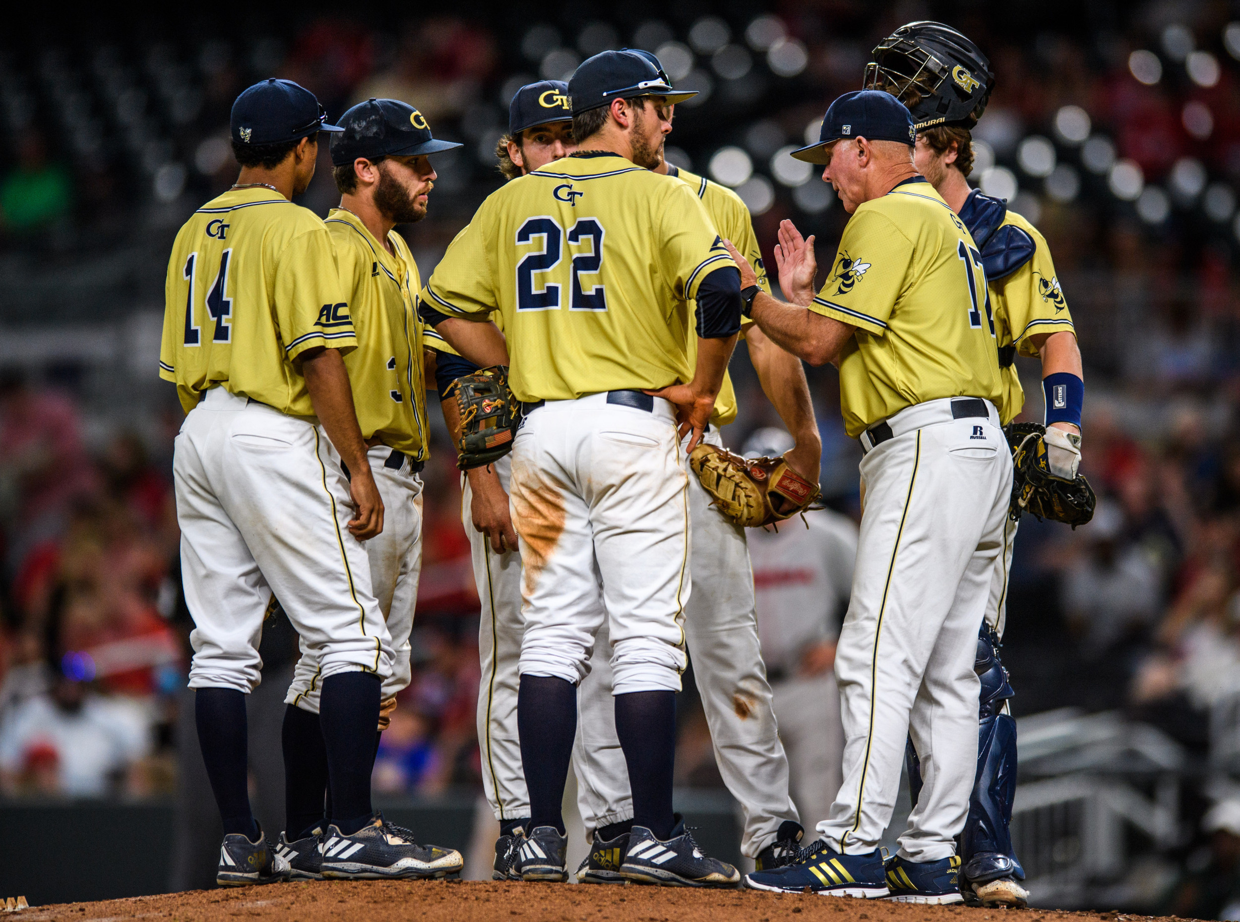 Coach Hall speaks to the infield