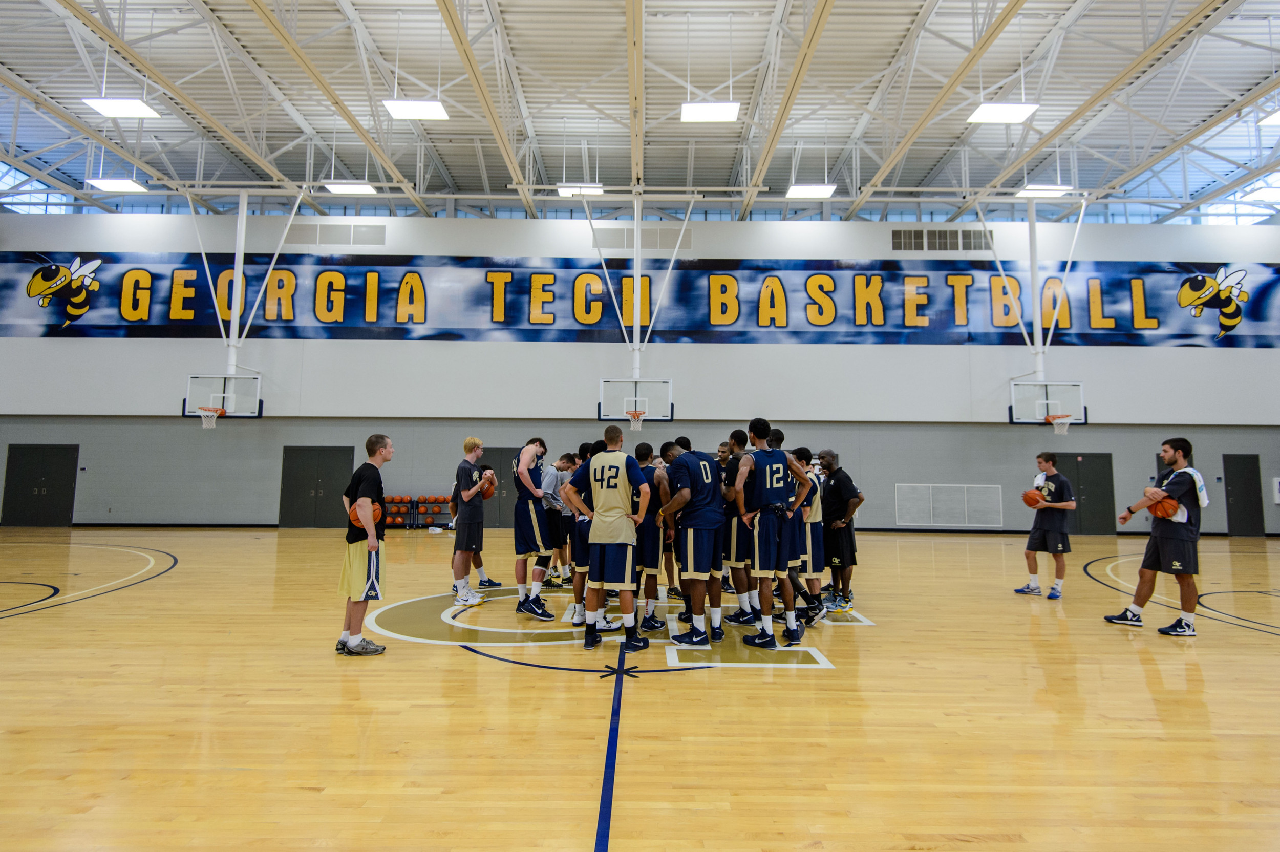 Coach Brian Gregory talks to the team after practice