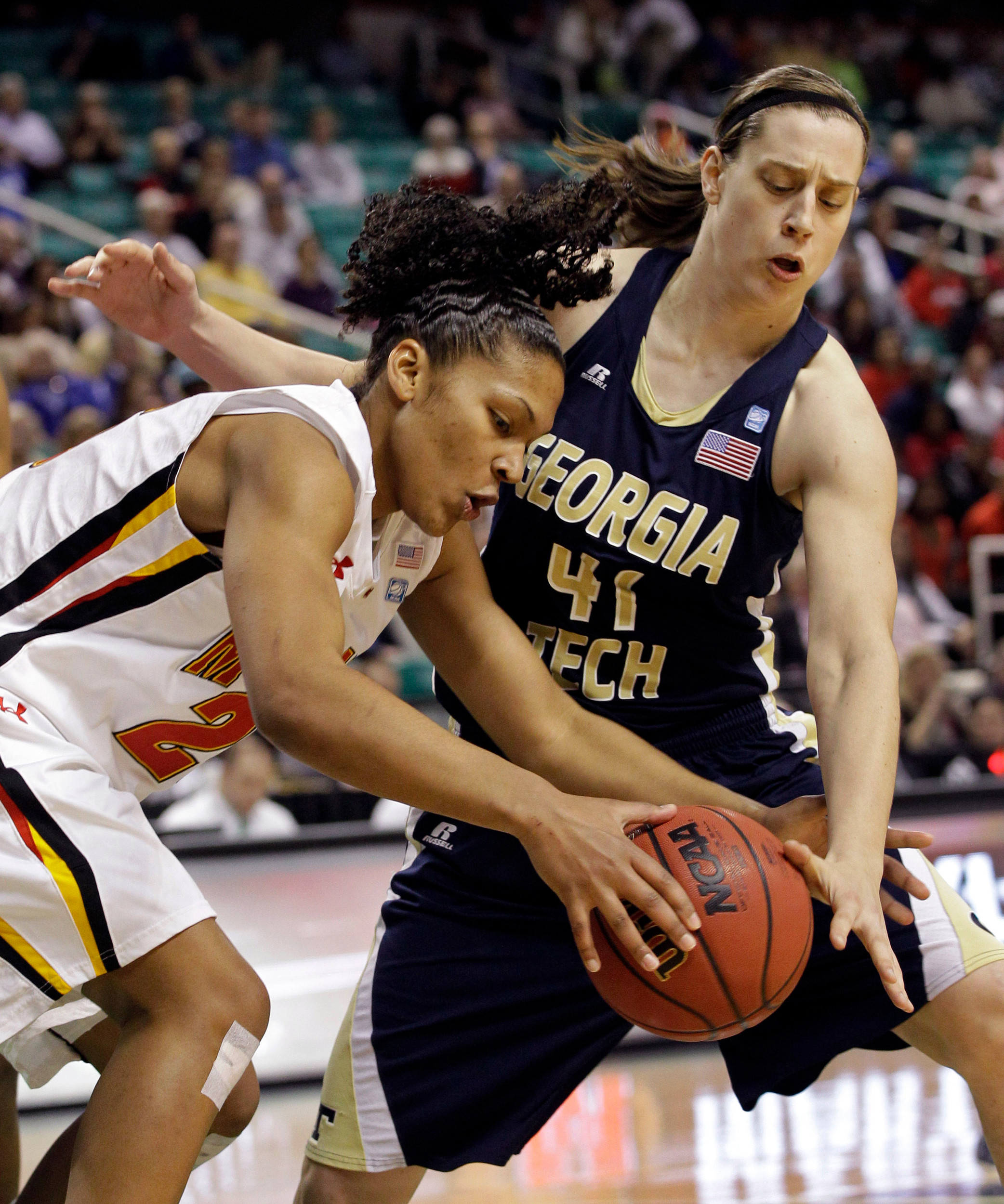 Maryland's Alyssa Thomas, left, and Georgia Tech's Tjasa Gortnar, right, battle for a loose ball during the first half of the NCAA Atlantic Coast Conference women's college tournament basketball championship game in Greensboro, N.C., Sunday, March 4, 2012. (AP Photo/Chuck Burton)