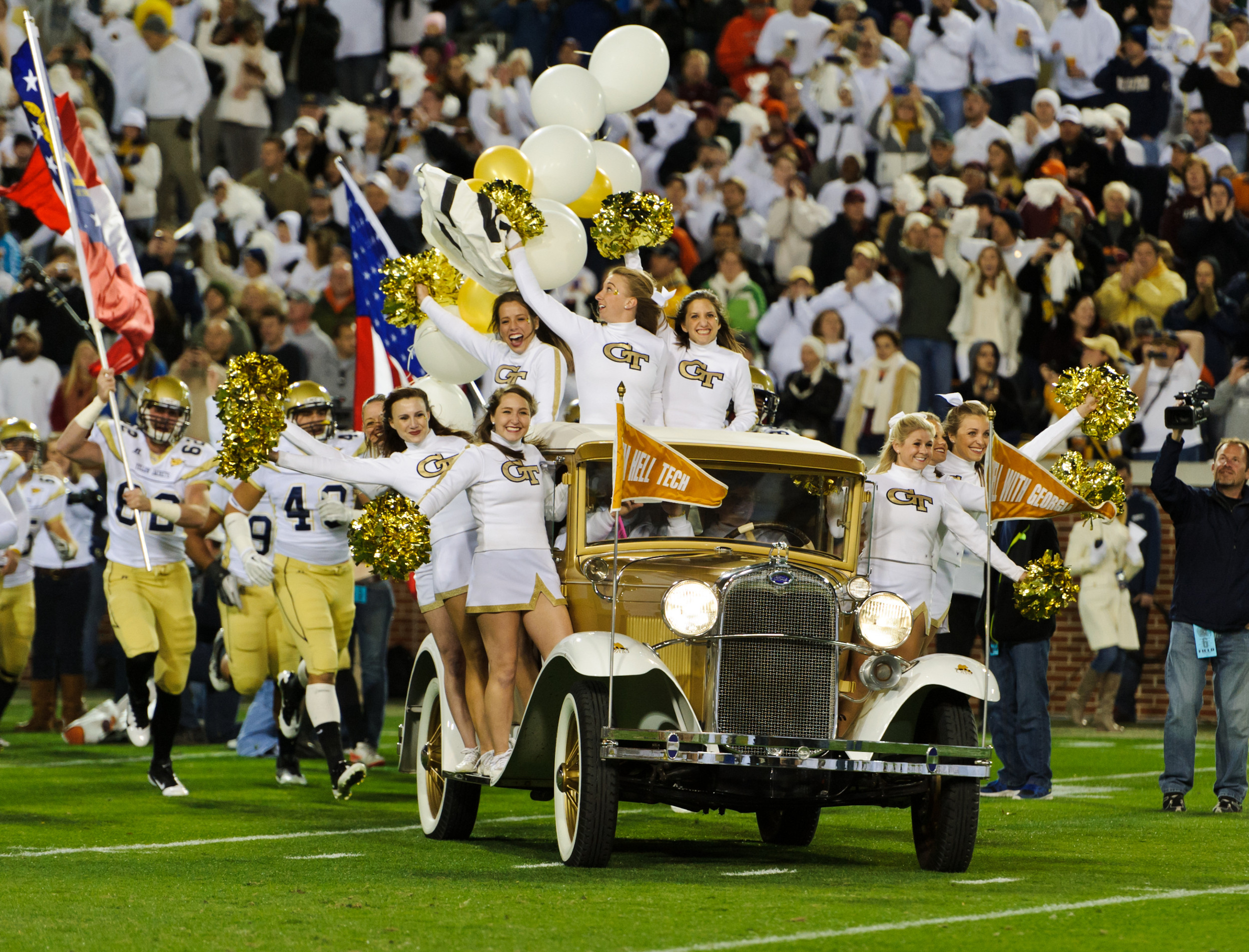 The Ramblin' Wreck leads the team onto the field.
