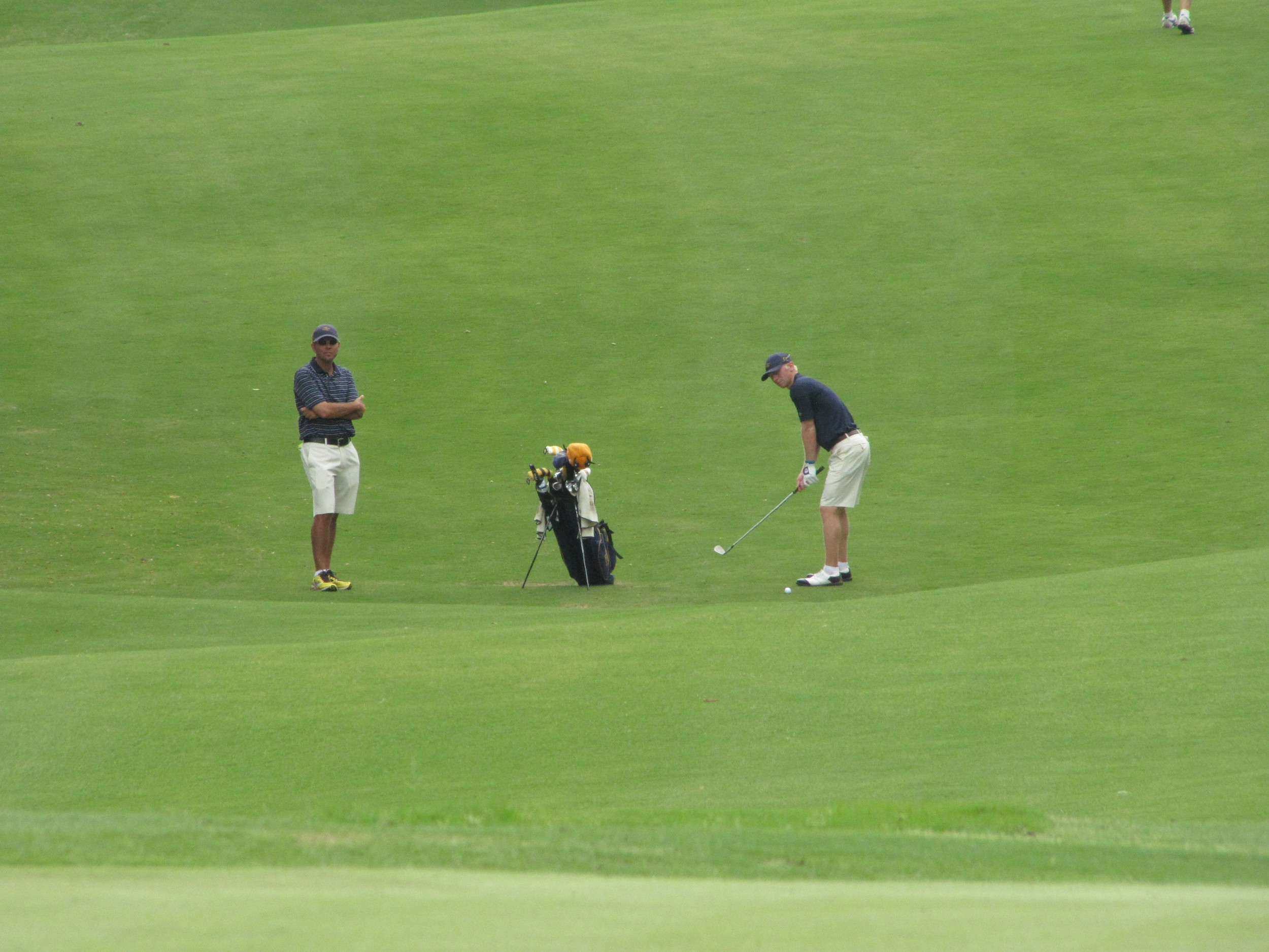 Anders Albertson and assistant coach Brennan Webb during the first round of the NCAA Raleigh Regional, May 15, 2014