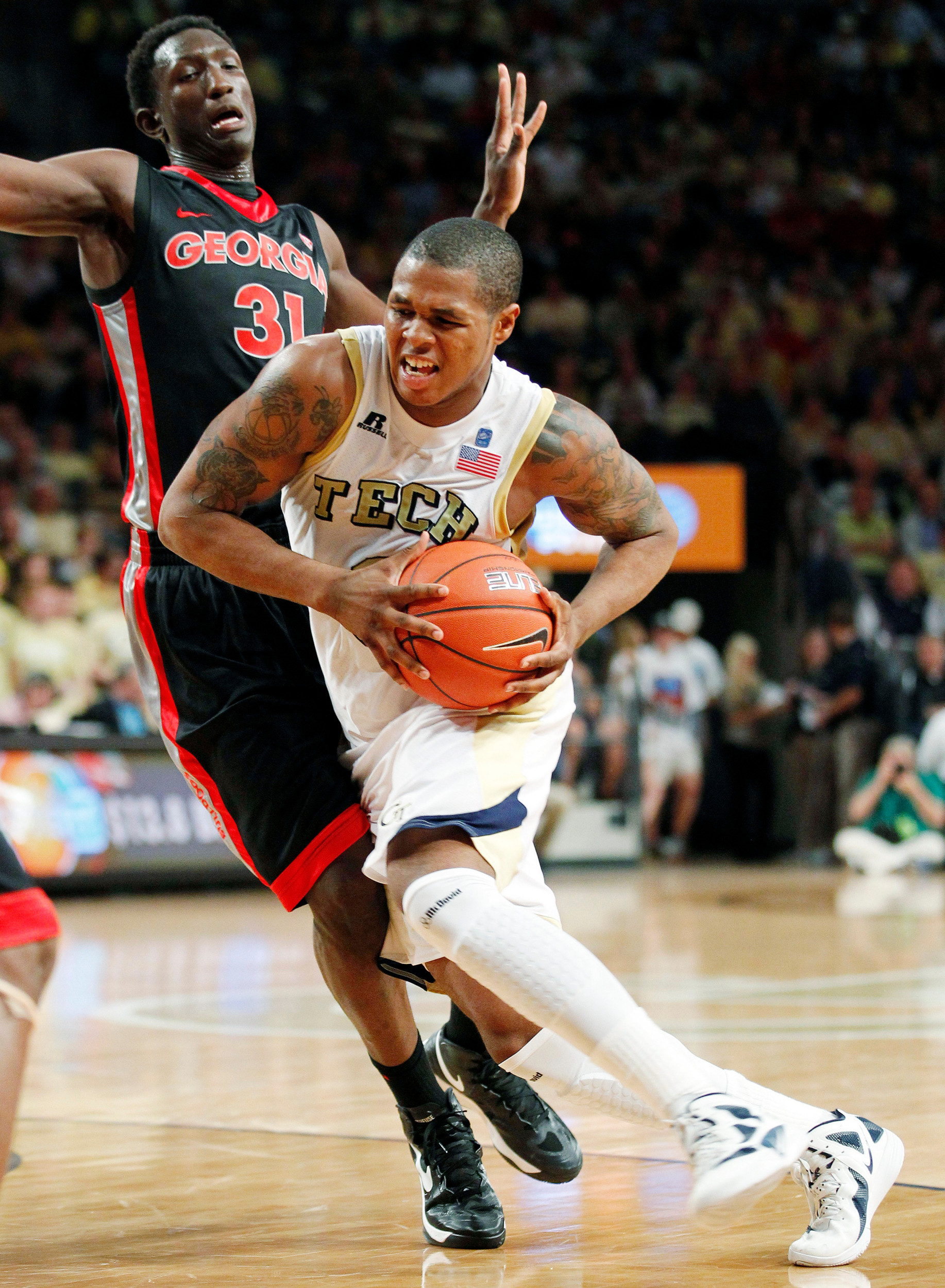 Georgia Tech's Marcus Georges-Hunt (3) drives to the basket as Georgia forward Brandon Morris (31) defends during the second half. (AP Photo/John Bazemore)