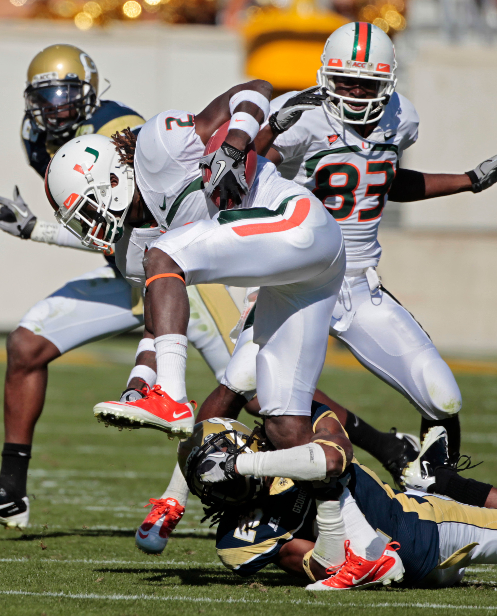 Miami running back Graig Cooper (2) can't escape from Georgia Tech cornerback Mario Butler (2) in the second quarter. (AP Photo/John Bazemore)