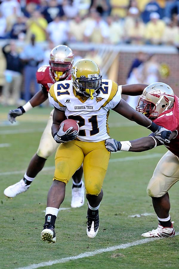 Jonathan Dwyer (21) looks for an opening against FSU's defense. Dwyer rushed for 145 yards, his second highest total of the season. Photo by LensEffects