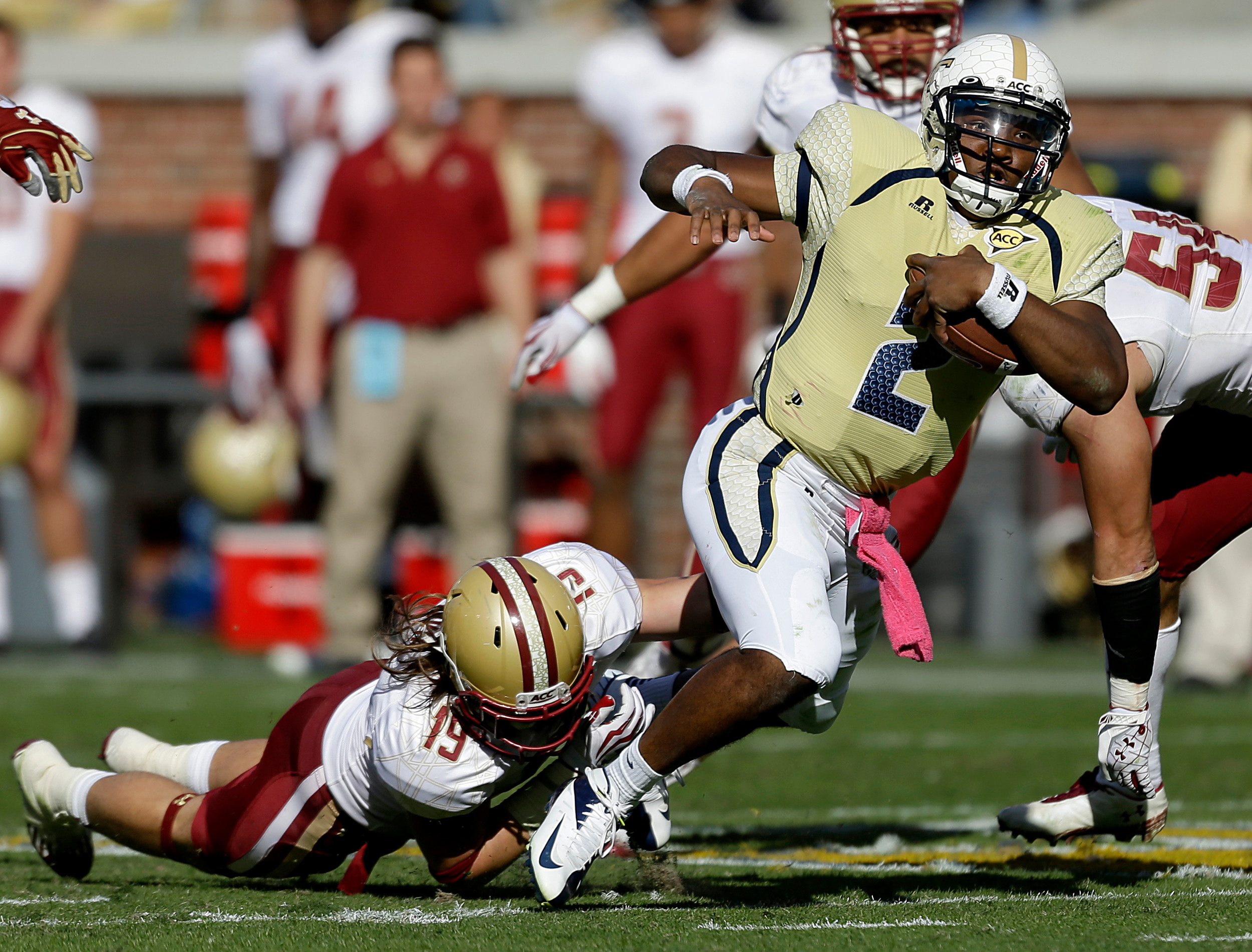 Georgia Tech quarterback Vad Lee, right, runs the ball past Boston College defensive back Sean Sylvia during the second quarter. Georgia Tech won 37-17. (AP Photo/David Goldman)