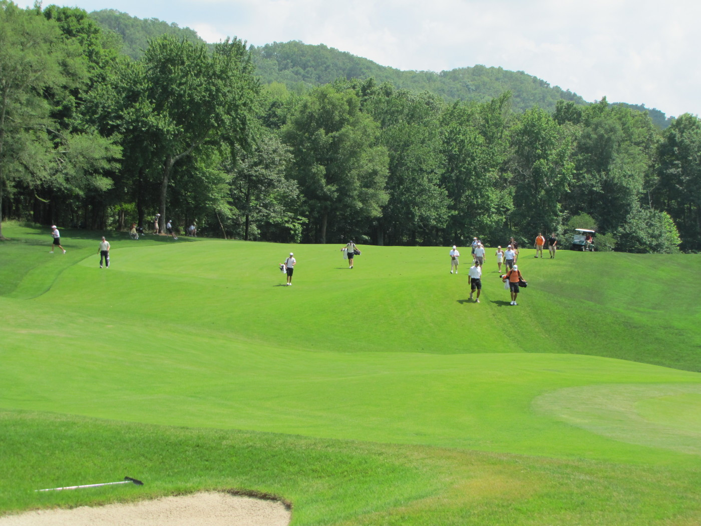 Kyle Scott's group approaches the first green during round 3 of the NCAA Golf Championship in Ooltewah, Tenn.
