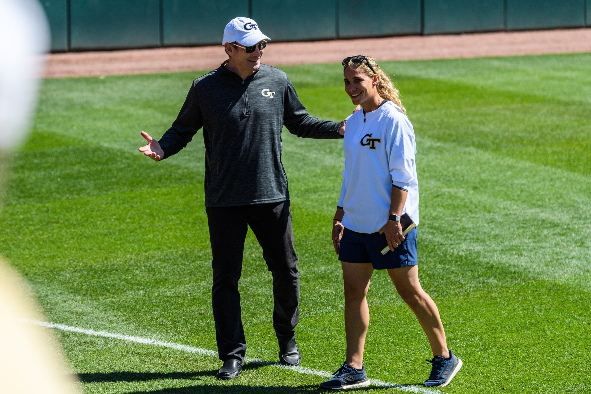 Director of Athletics Todd Stansbury chats with Coach Aileen Morales after the game