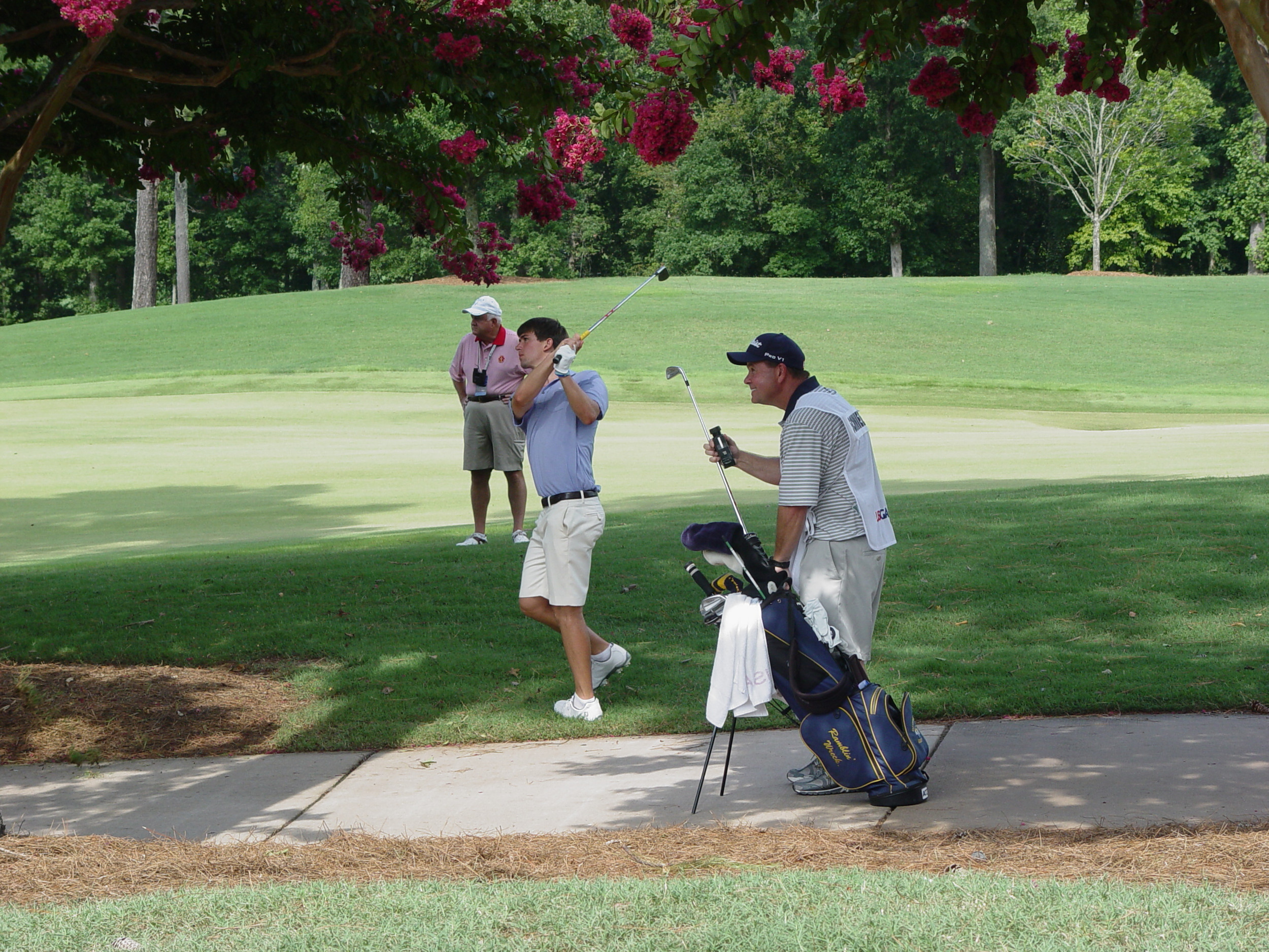 Ollie Schniederjans and caddie Lance Bailey during the first round of the U.S. Amateur championship, Highlands Course, Atlanta Athletic Club, August 8, 2014